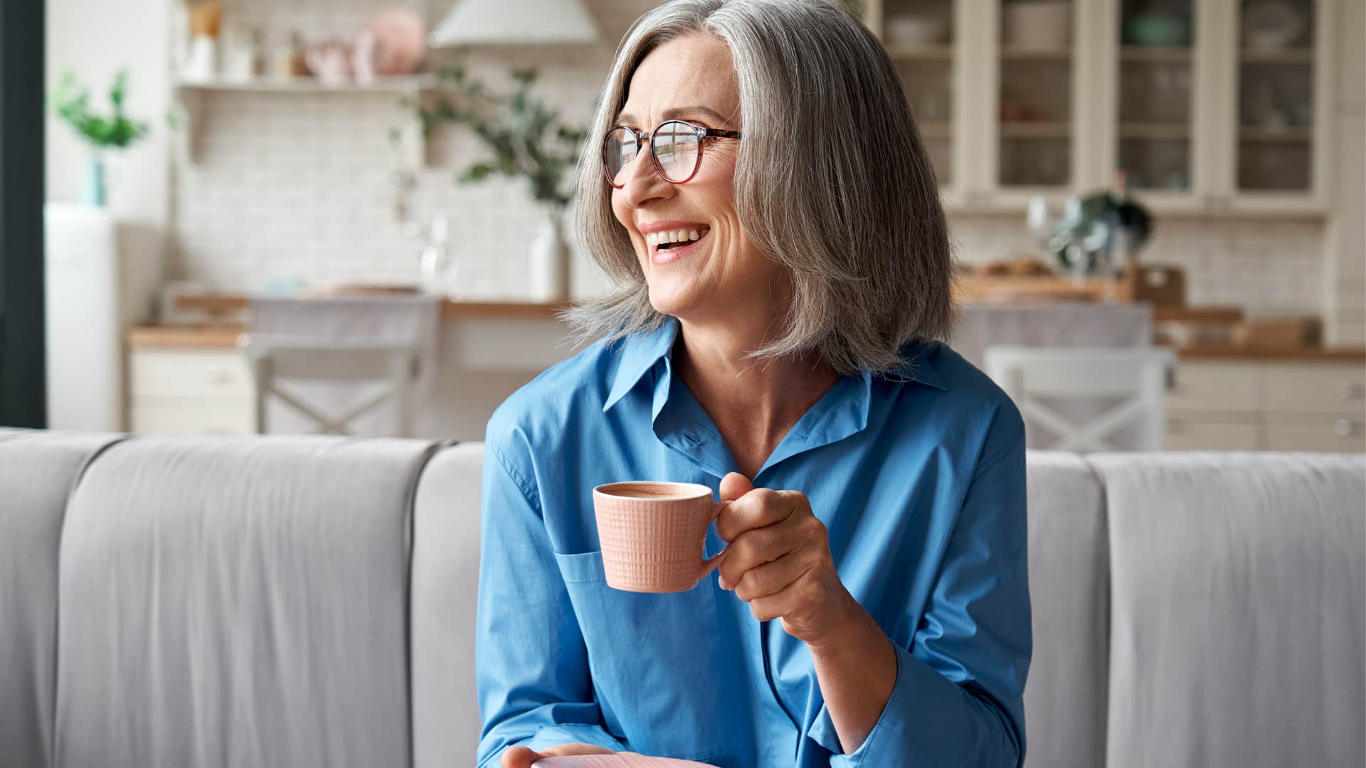Woman who appreciates silence drinking coffee at home.