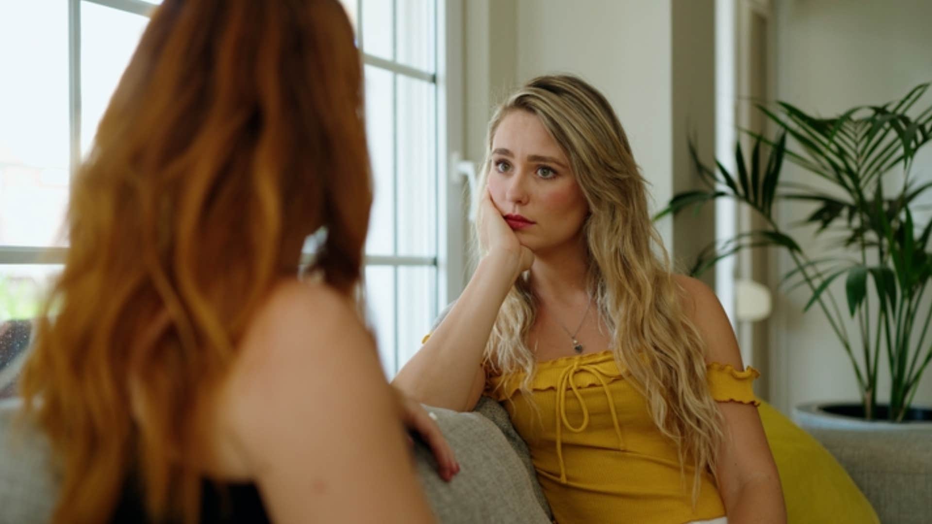woman refraining from sharing personal details about herself to friend