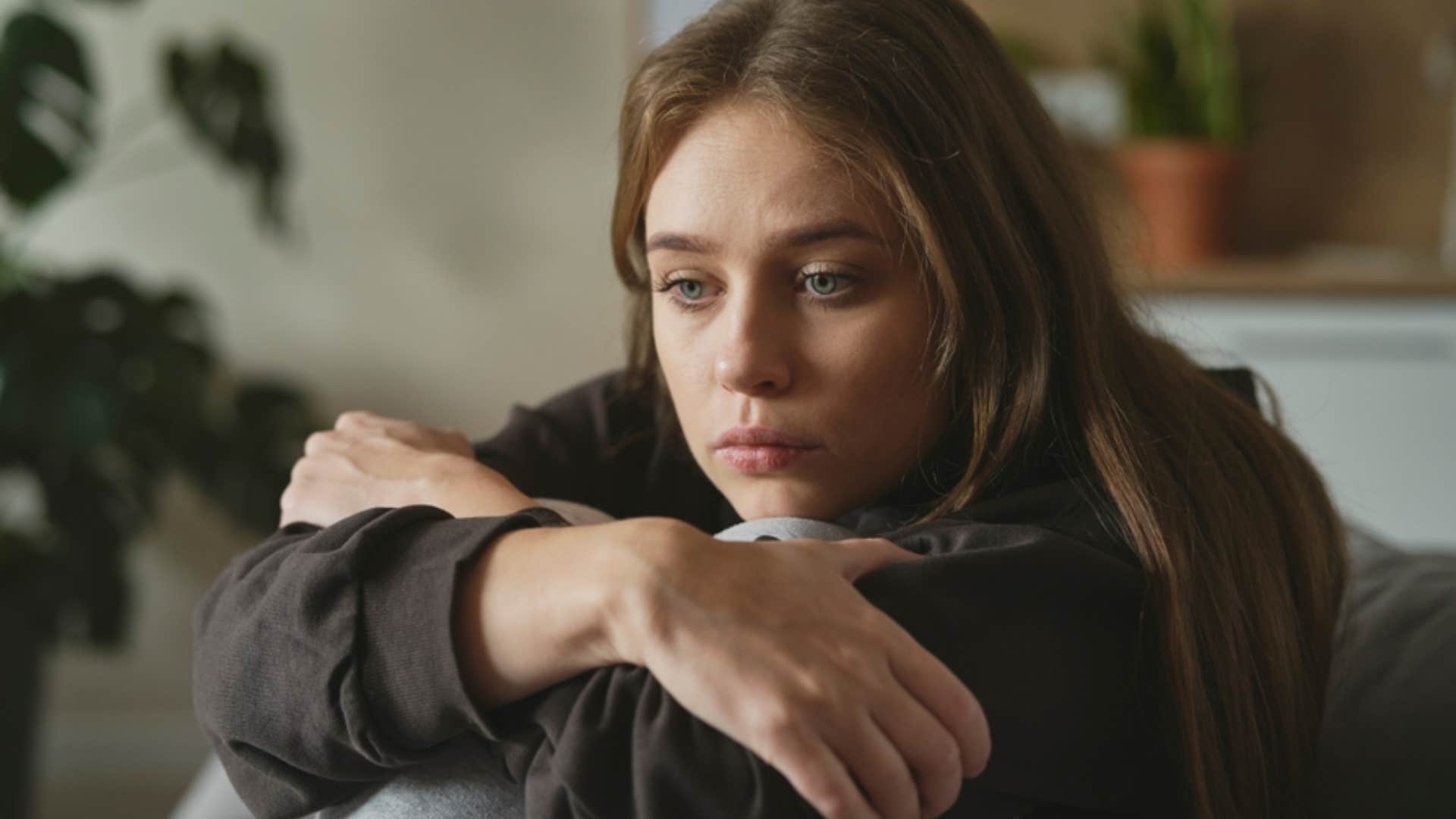 unhappy woman convincing herself it's not that bad since her spouse doesn't cheat 