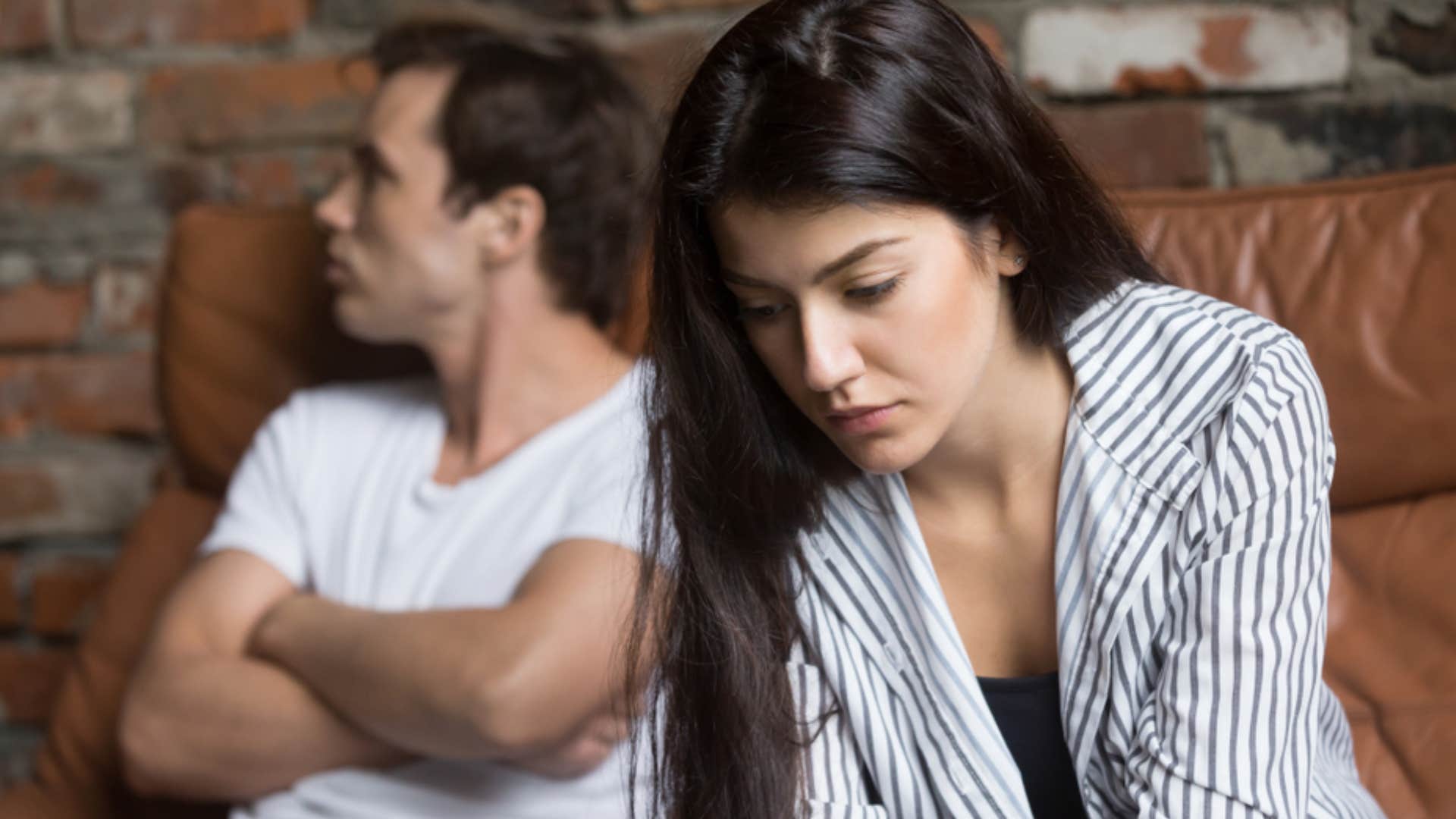 unhappy married couple looking too busy to connect