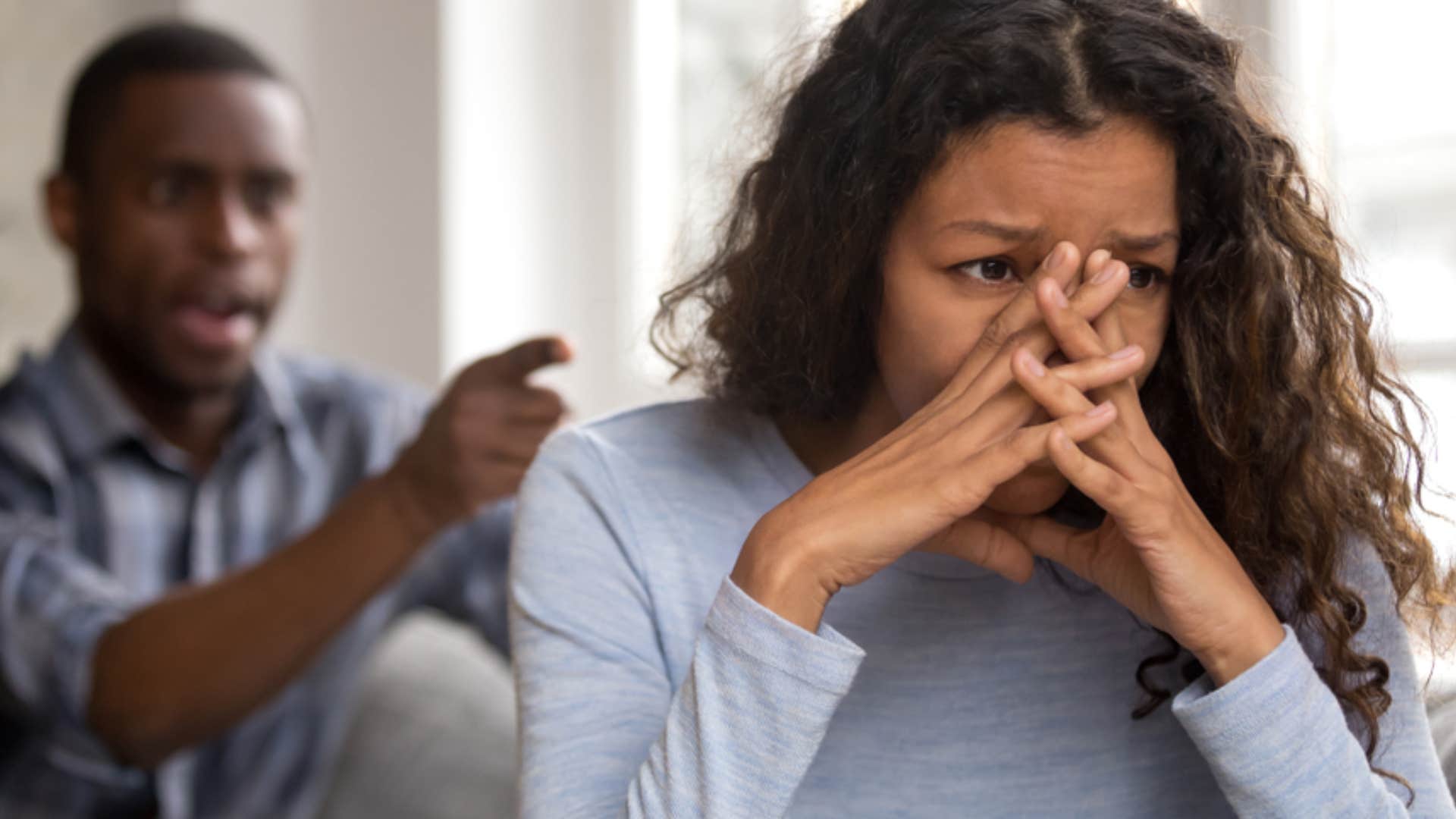 woman fearful of her controlling partner who forbids her from talking to anyone else 