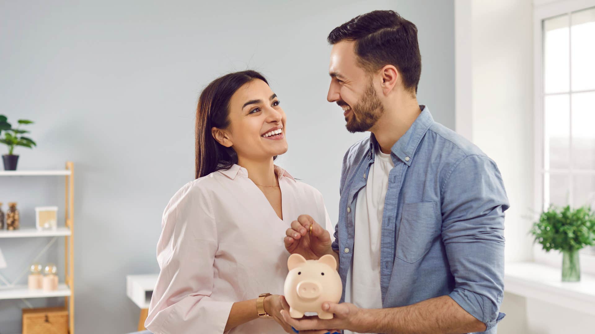 couple holding piggybank planning for the future together