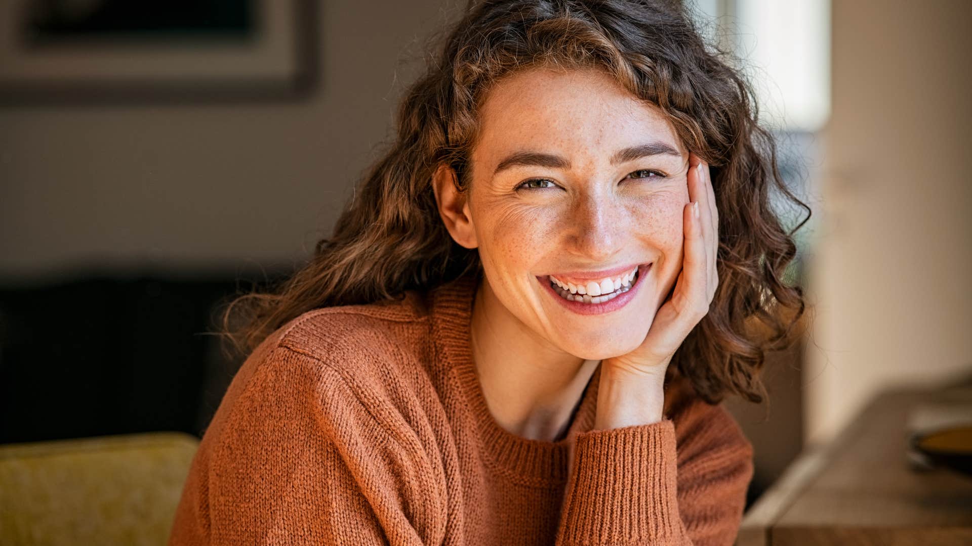 woman smiling while thinking of partner