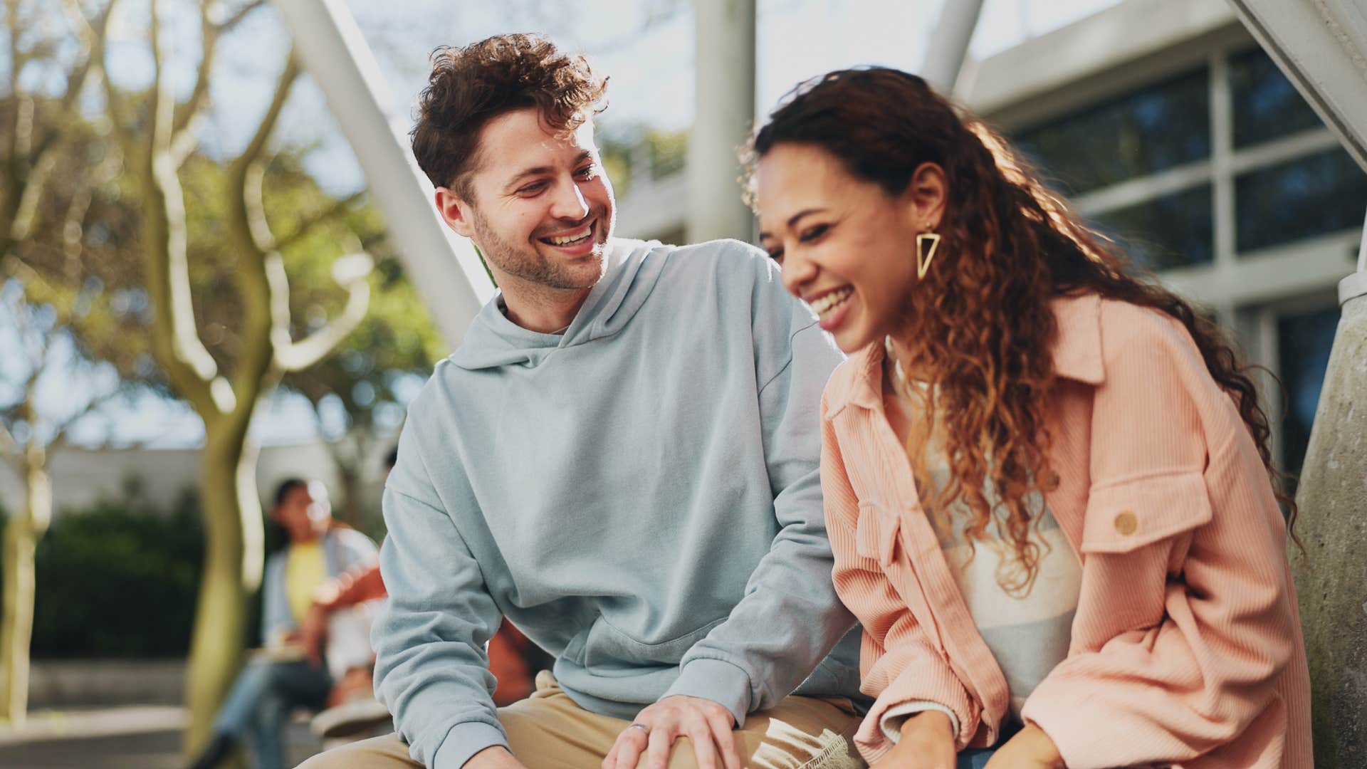 couple laughing together smiling happily