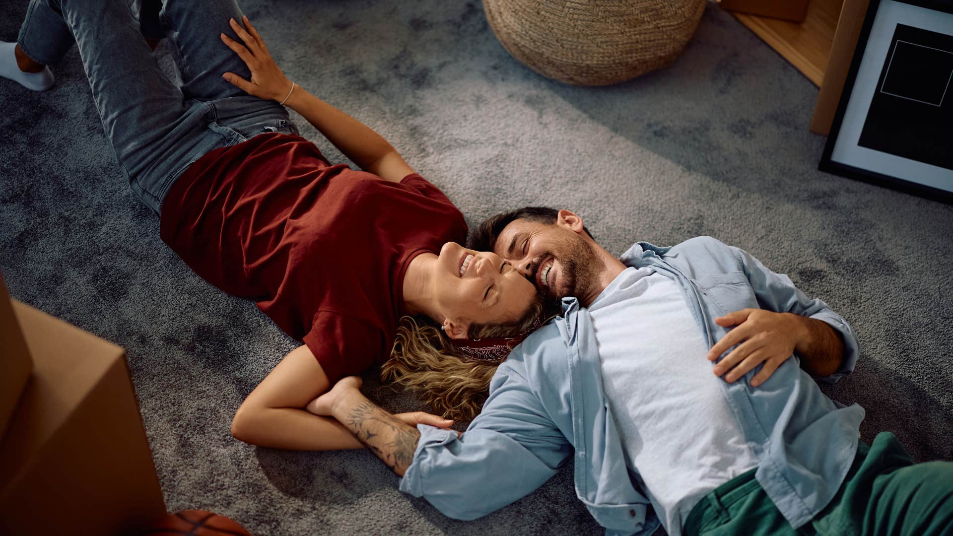 couple laying on the floor together feeling safe and loved