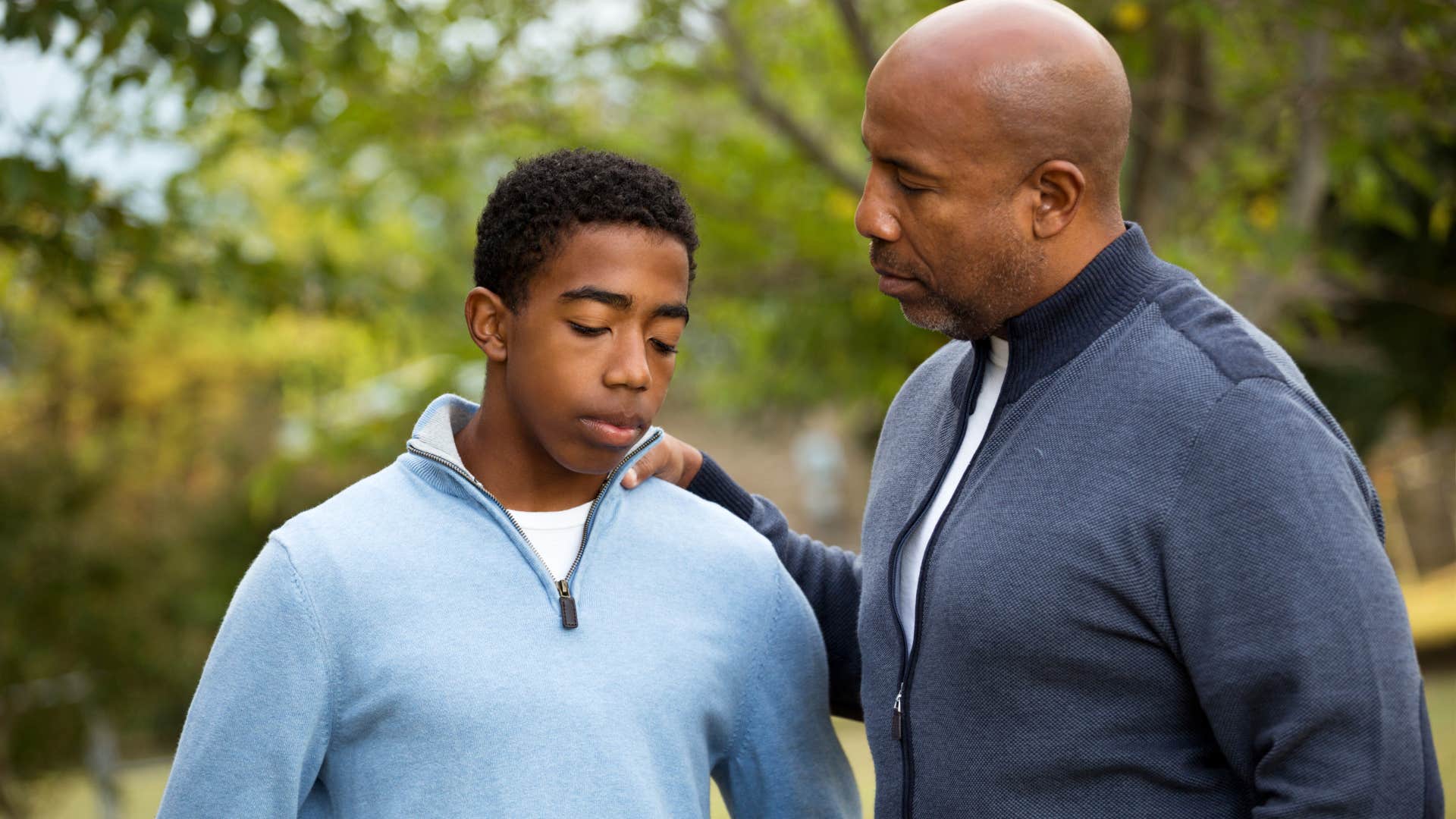 Man saying "you just have to work harder" to his teenage son.