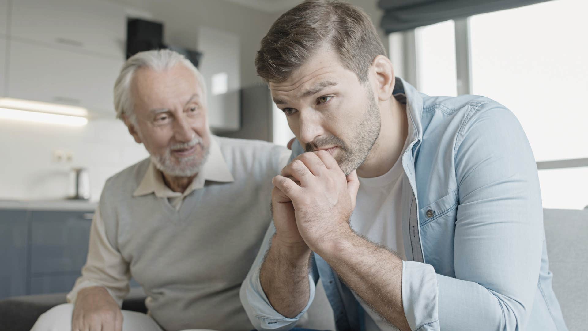 Man saying "You think you have it hard?" to his upset adult son.
