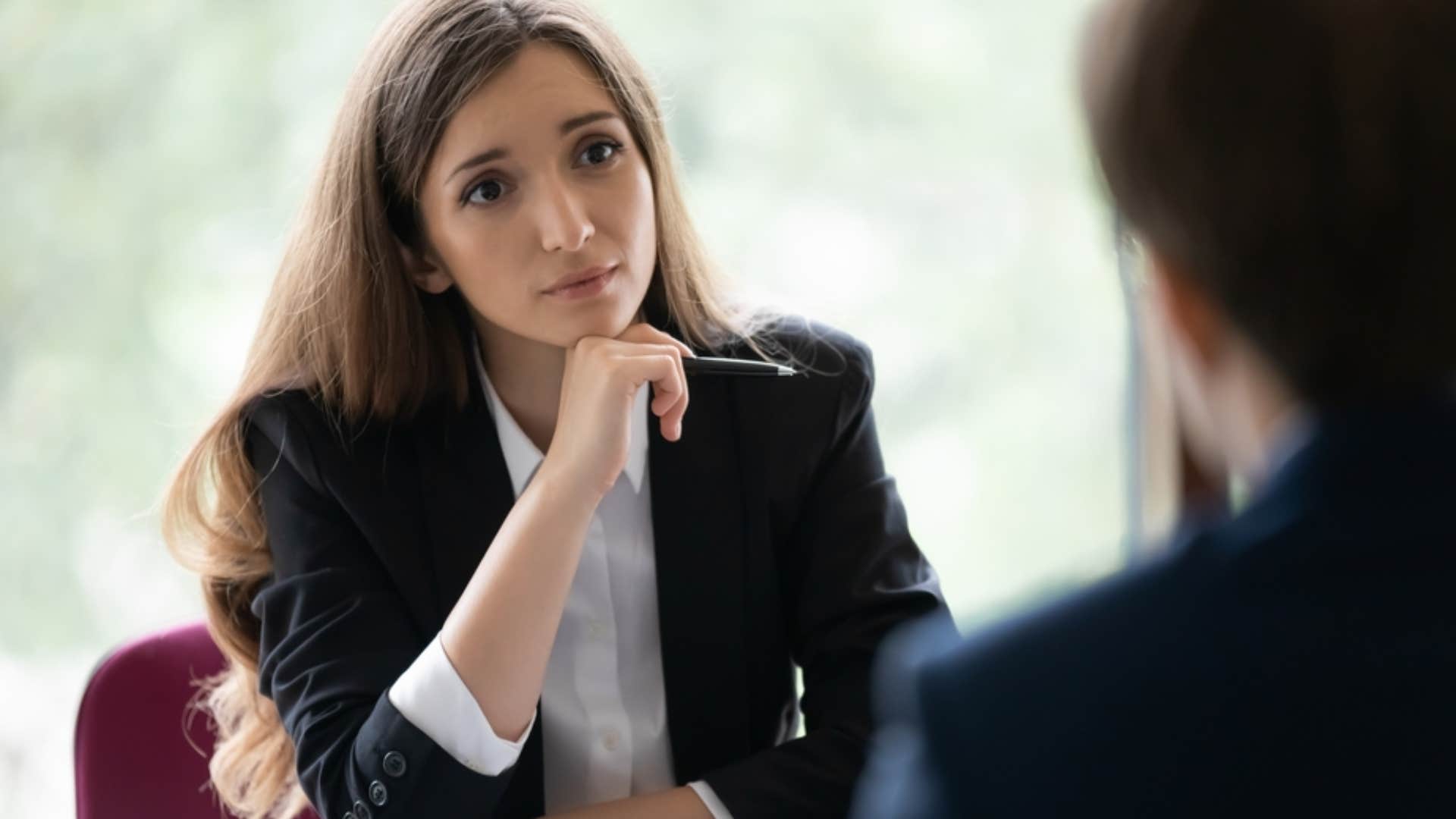 woman reminding insecure colleague who insults her that shes not the enemy but their mirror