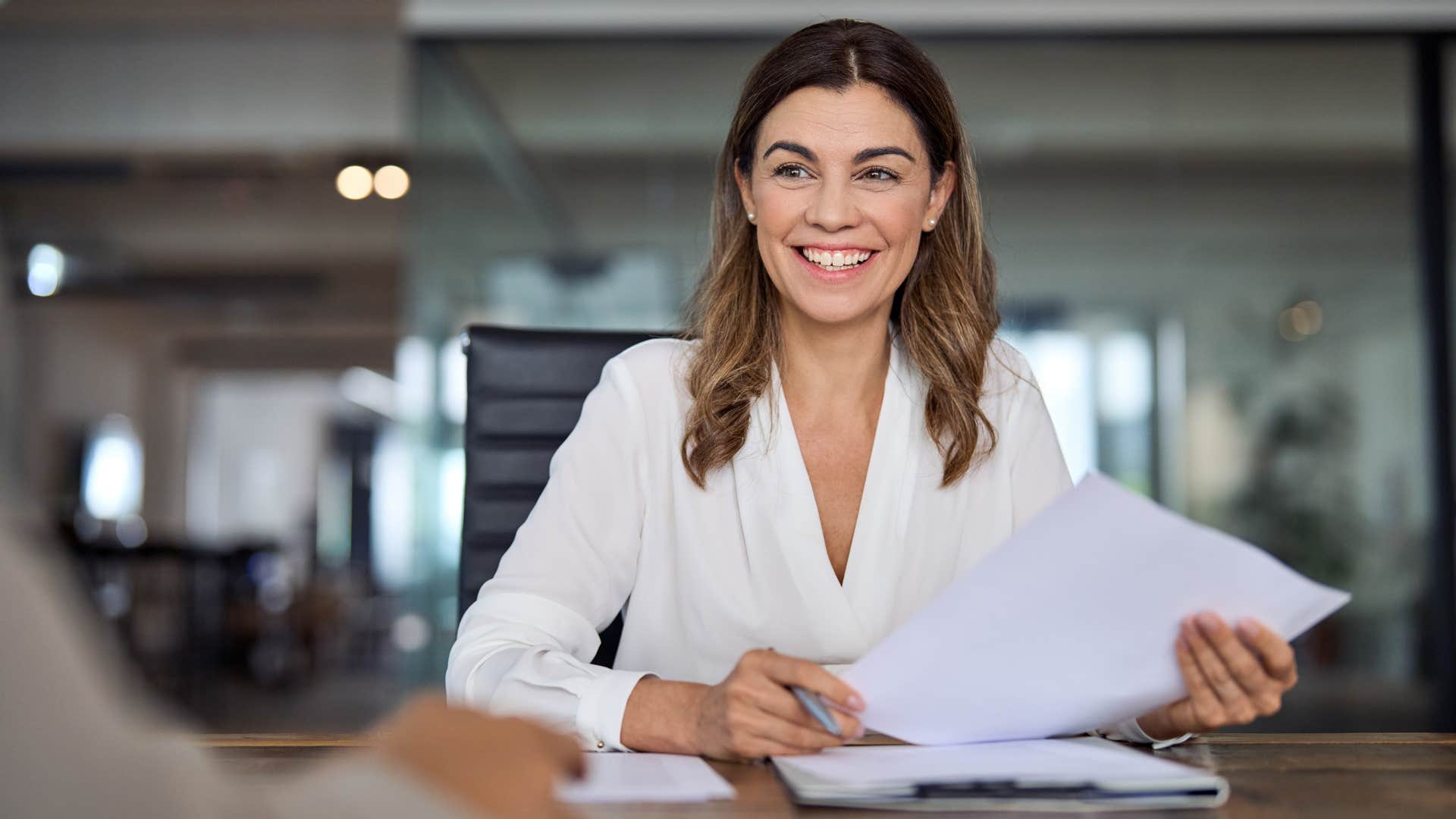 a woman tells her coworker that she has things handled