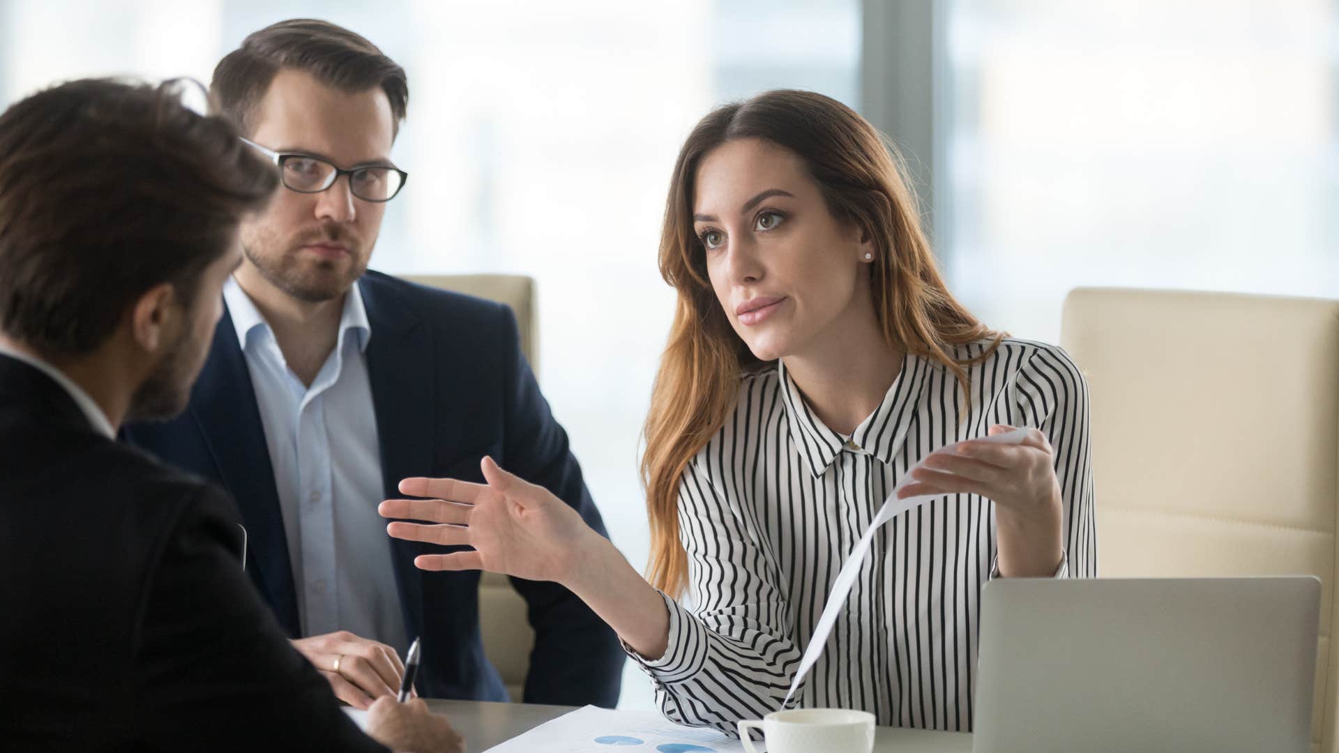 a young woman tells her coworker that she prefers to keep her personal life private
