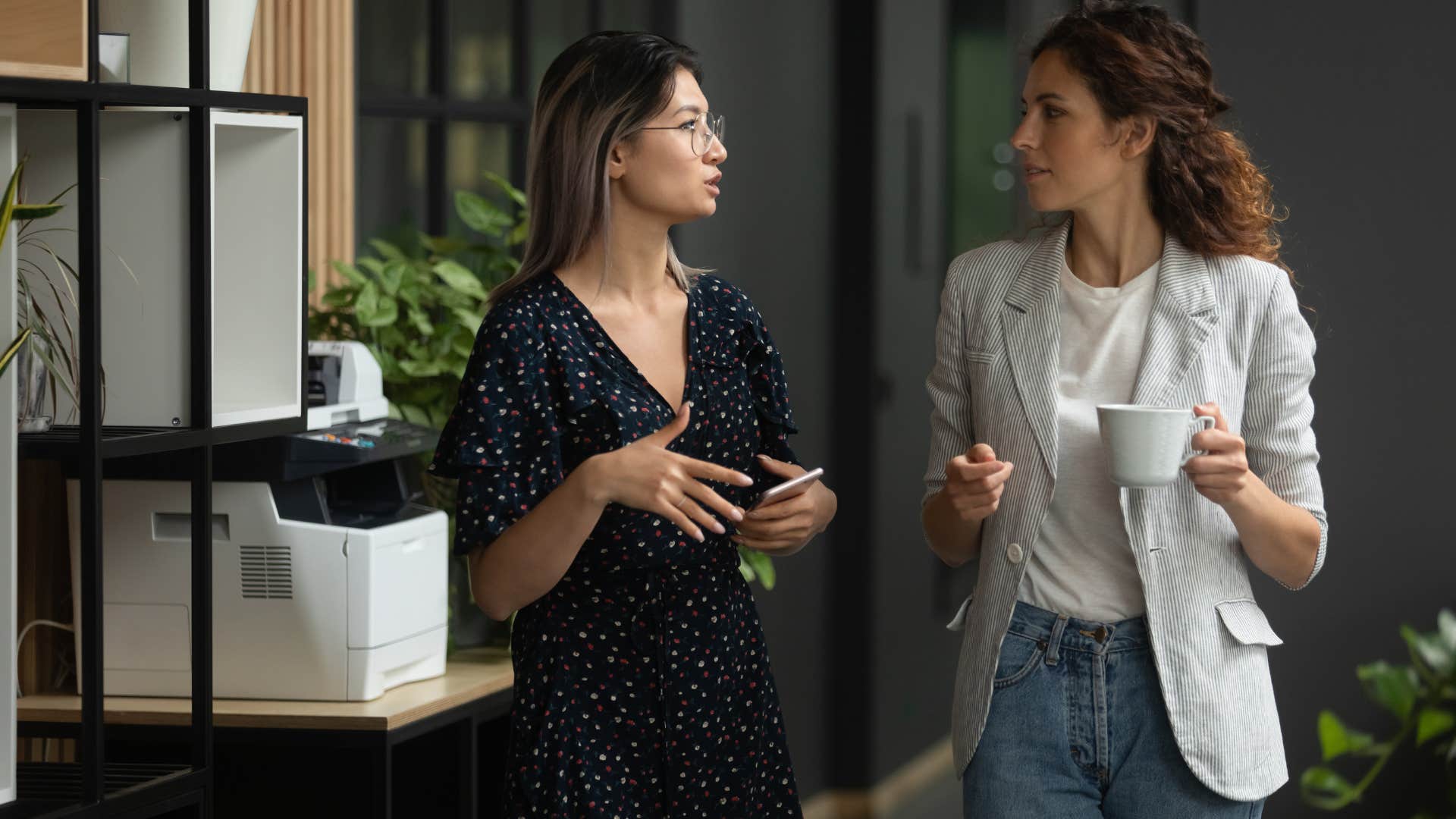 two women working on solution during conversation