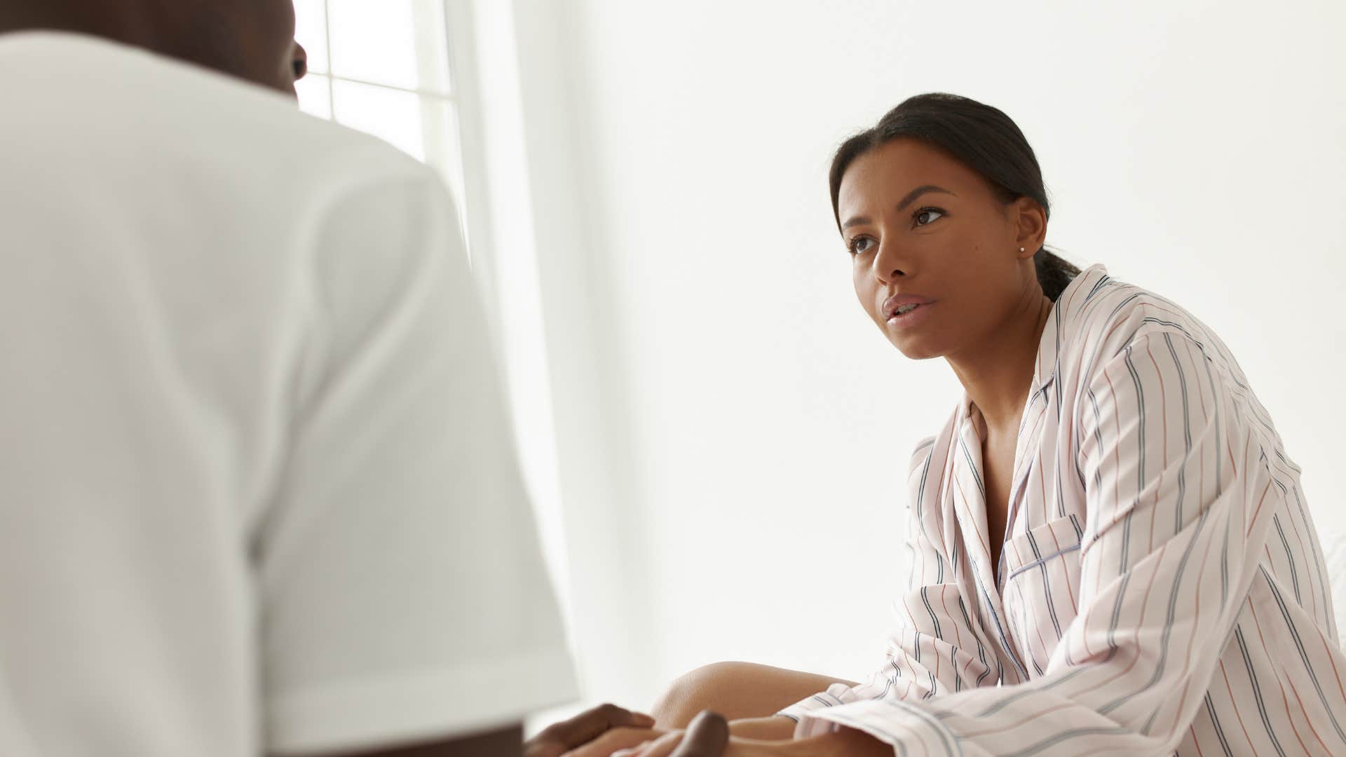 woman having accusatory conversation with partner