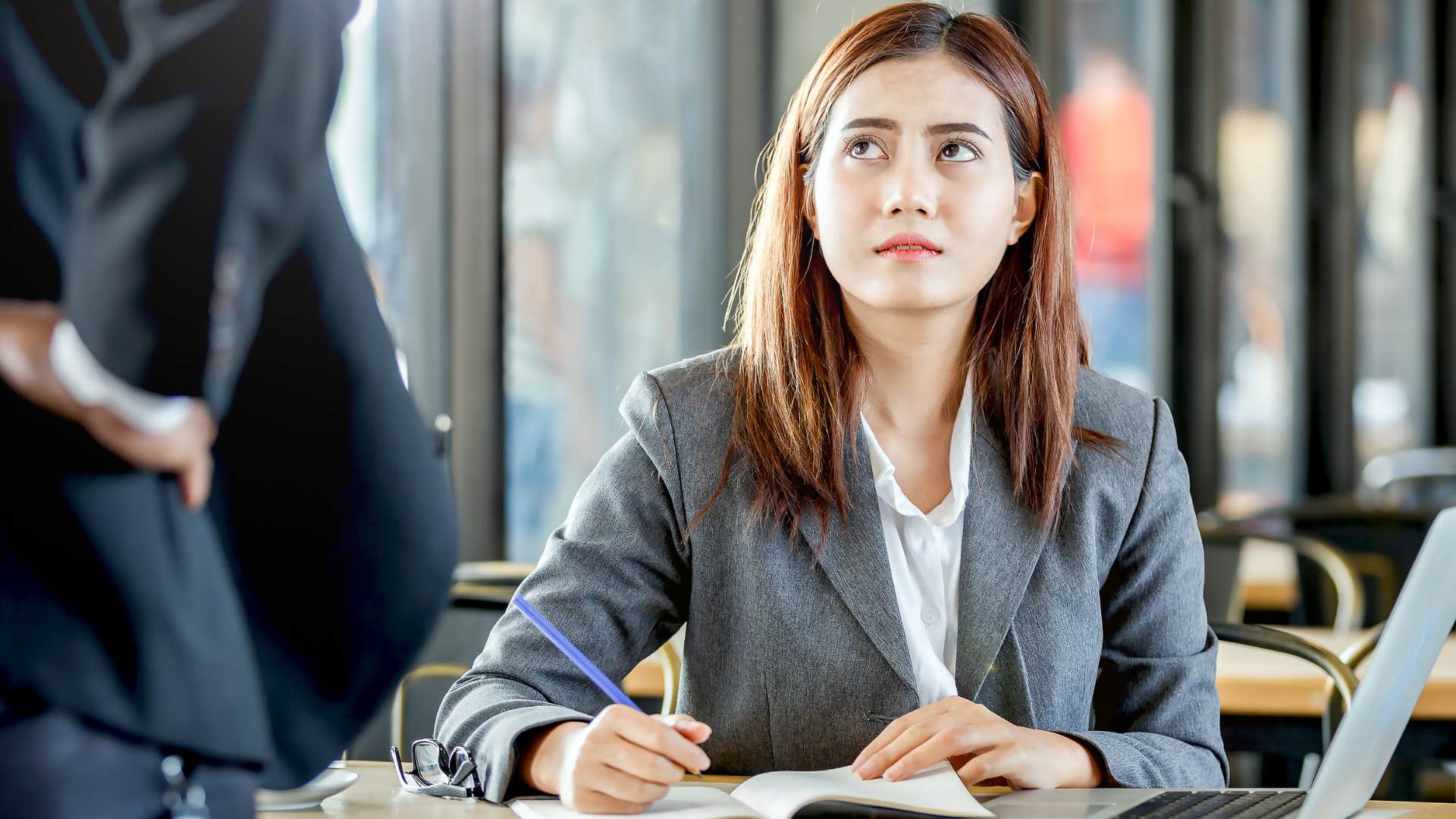 annoyed woman telling colleague she wont take no for an answer