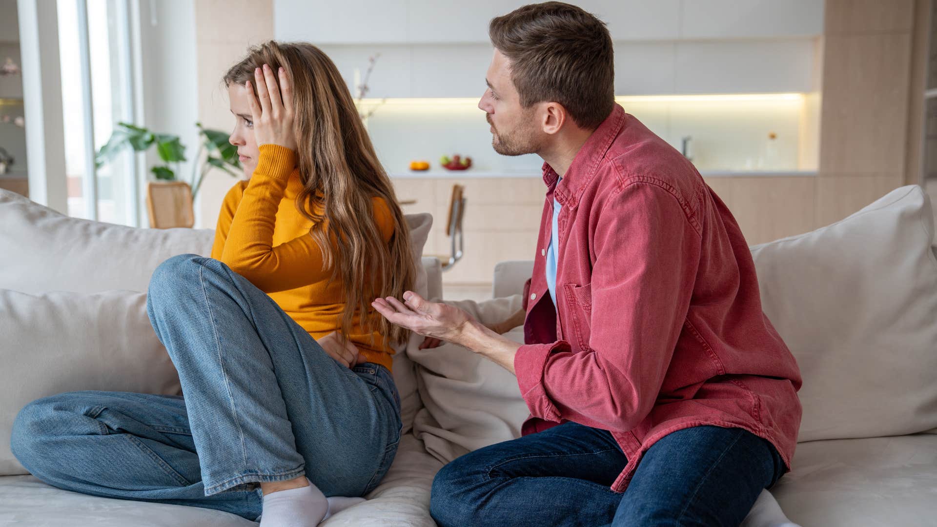 arguing couple husband telling his wife he doesnt know what she wants him to say