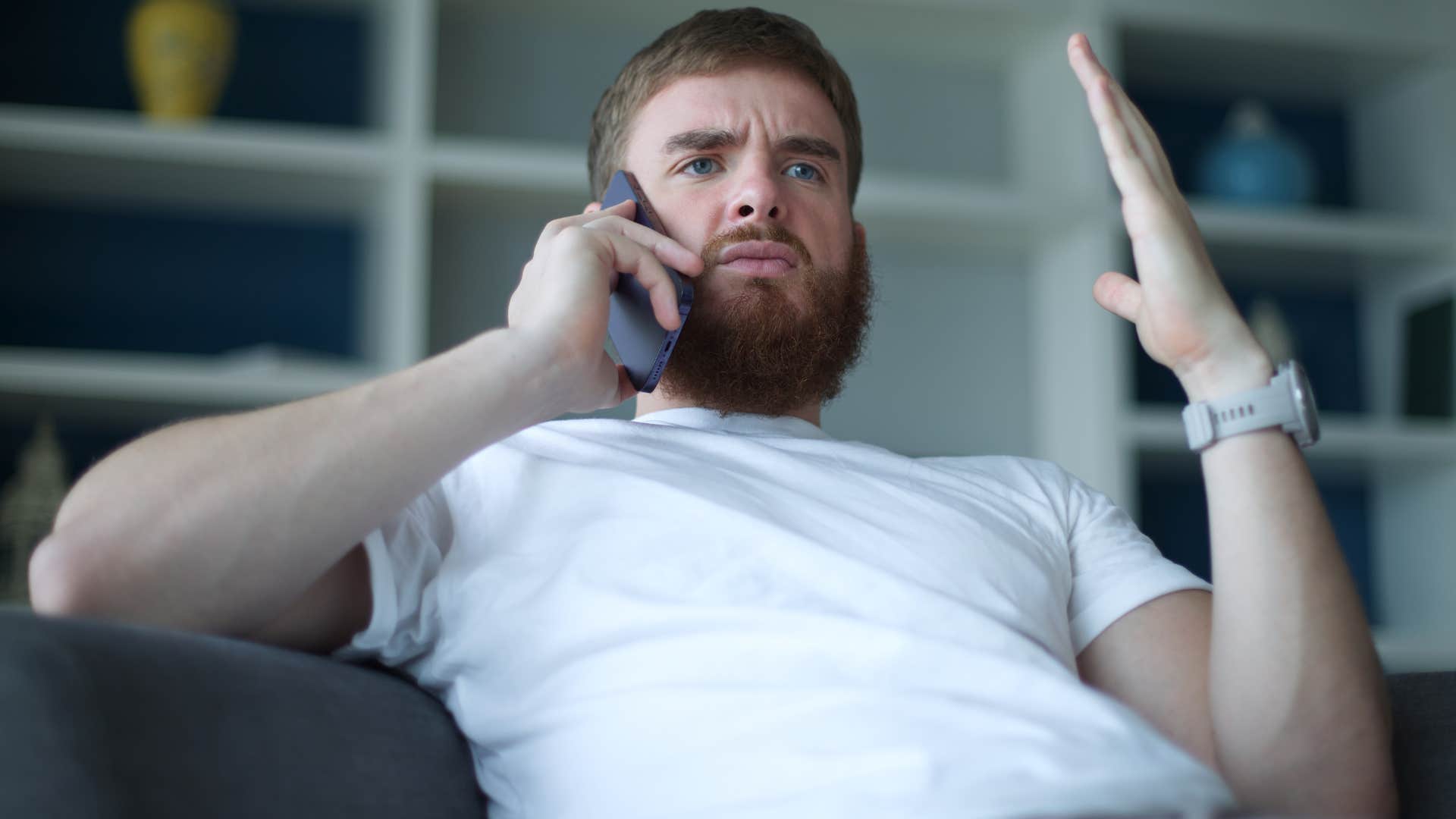 Upset man saying "you always make everything about you" on his phone.