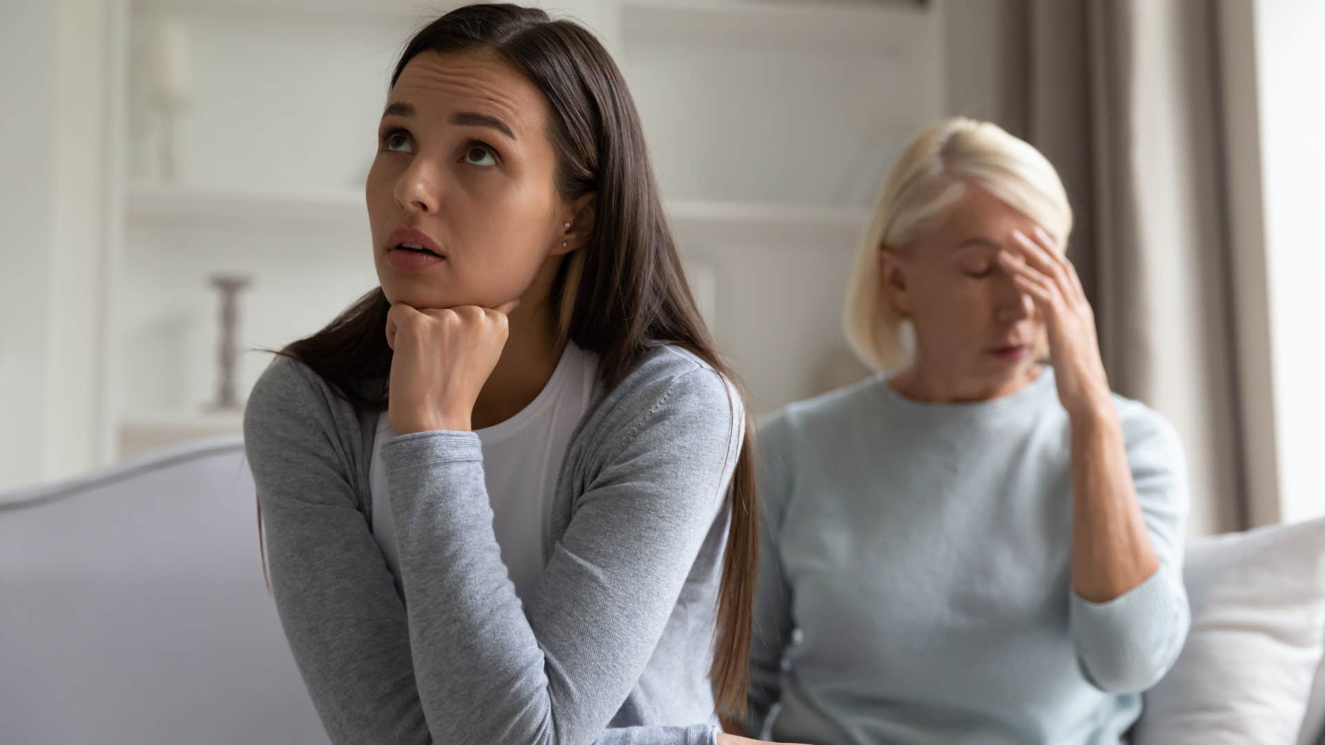 Woman saying "you owe me" to her upset mother.