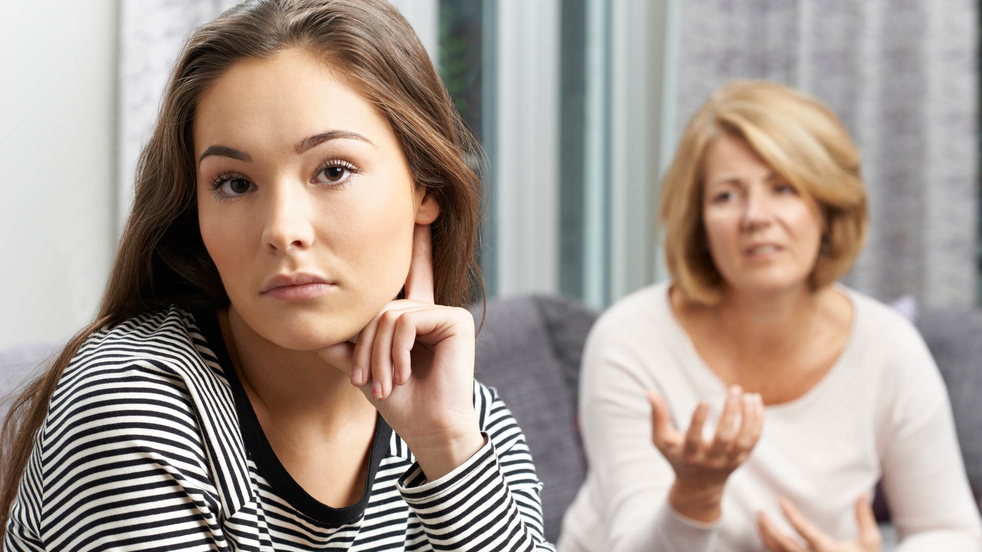 Woman turned away from her mother saying "I'm too busy."