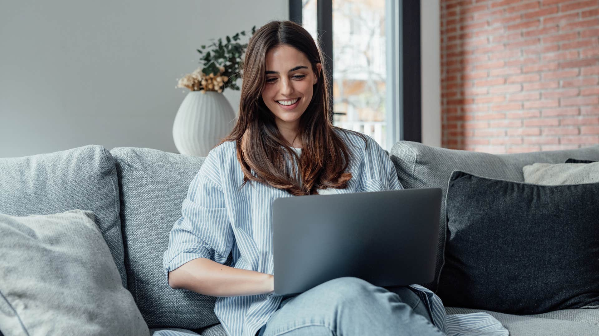 woman typing on laptop