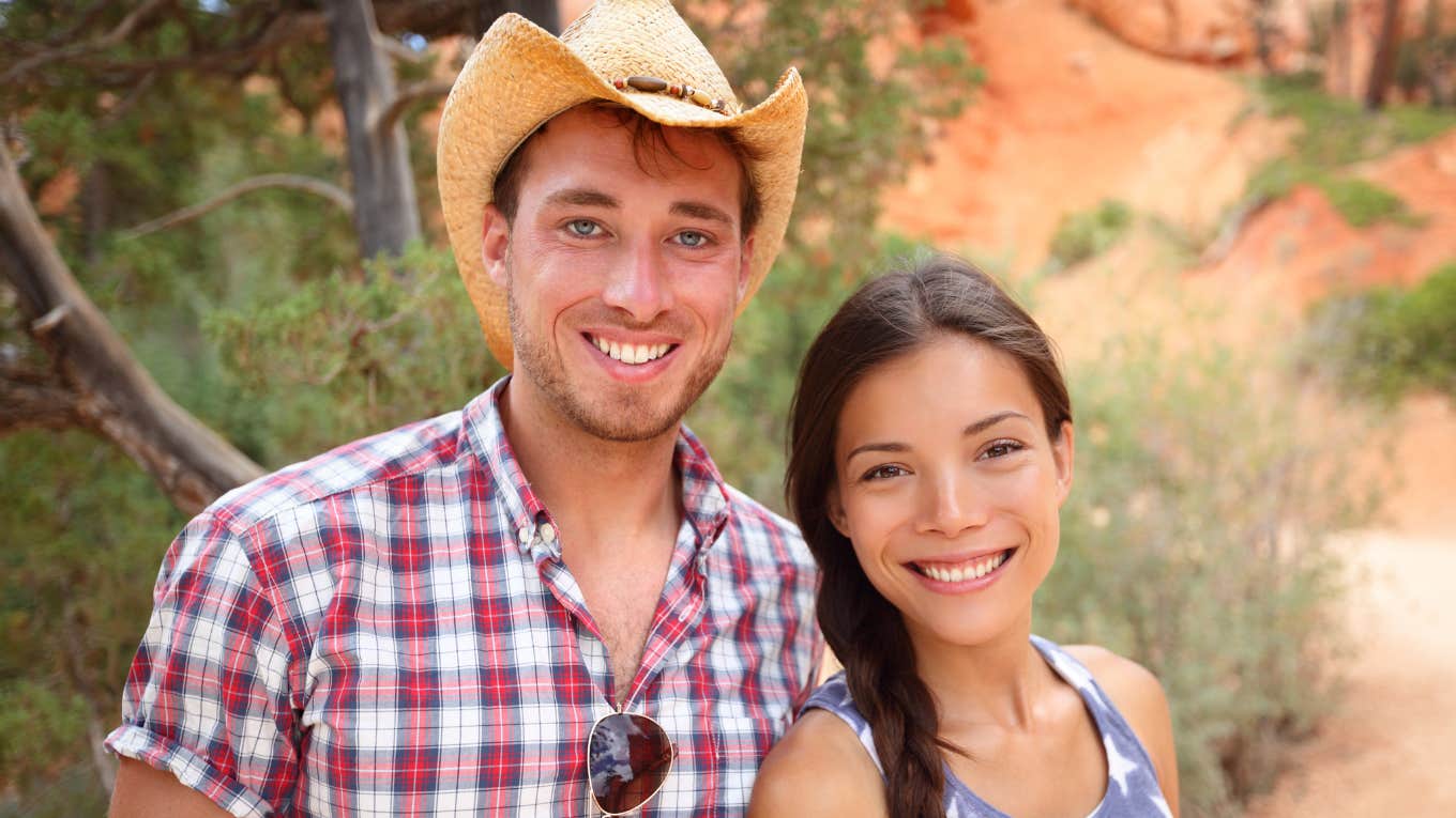 Phrases People From The South Say That Make No Sense To The Rest Of The Country southern couple standing outdoors wearing cowboy hat