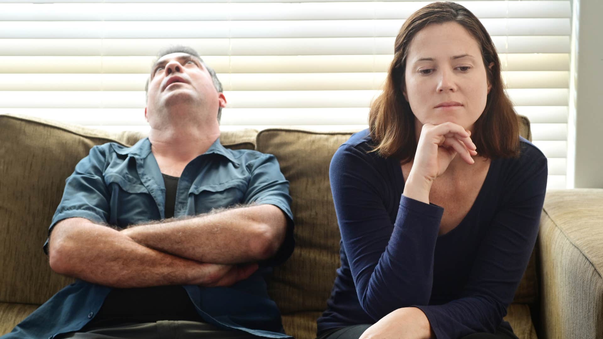 woman thinking i didn't expect this from you next to annoyed partner