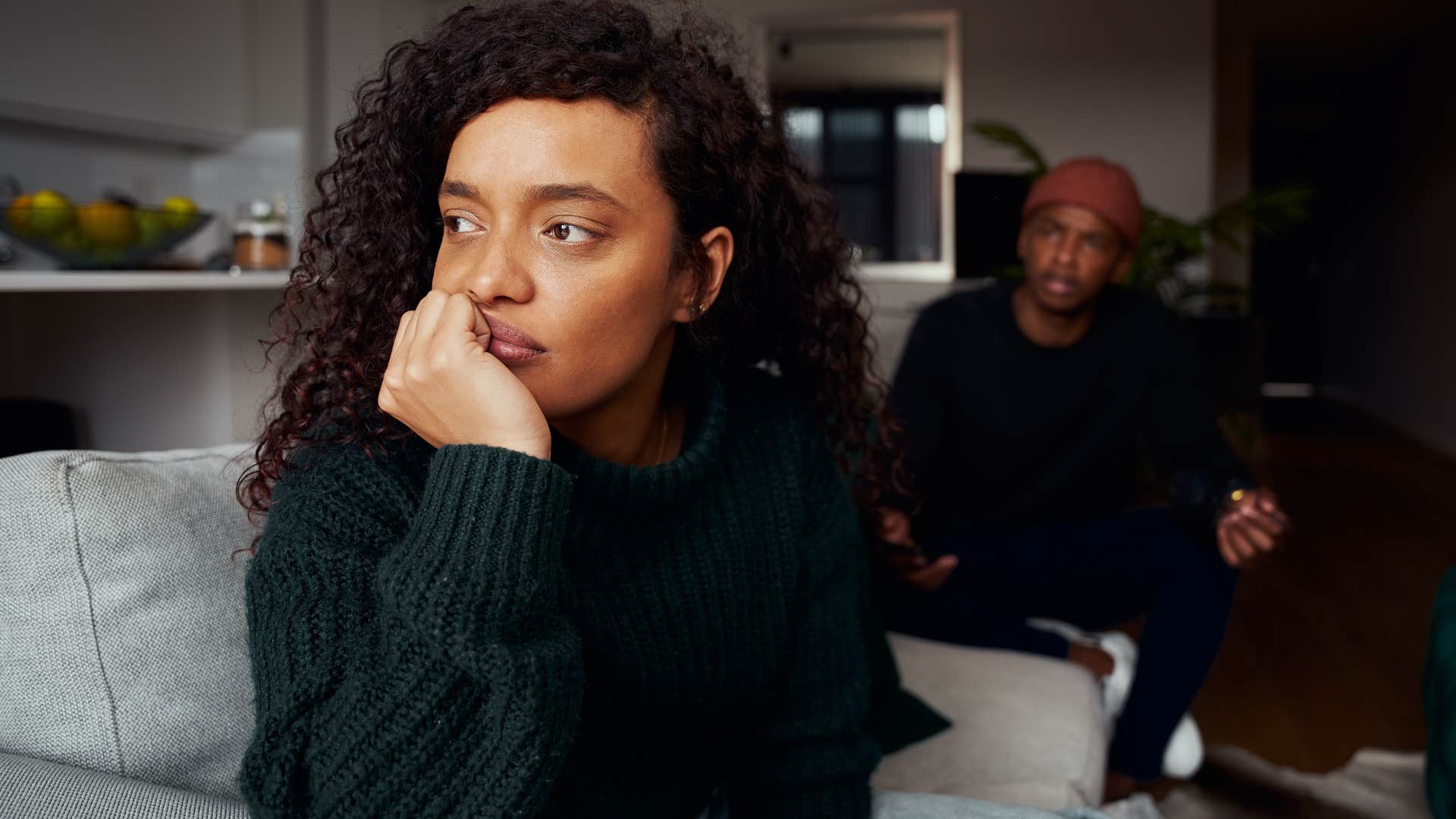 woman thinking shes not that important to partner turned away from him