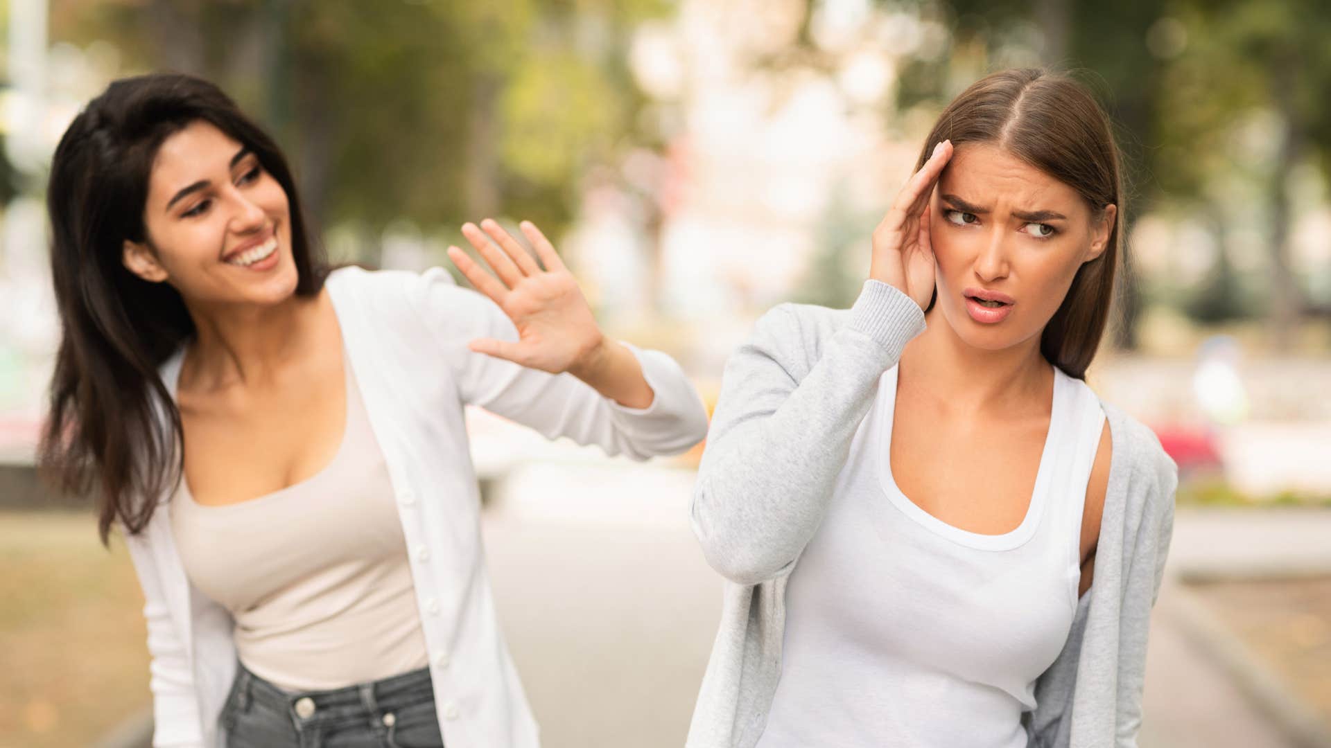 woman trying to make her friend feel inferior by saying she's come a long way