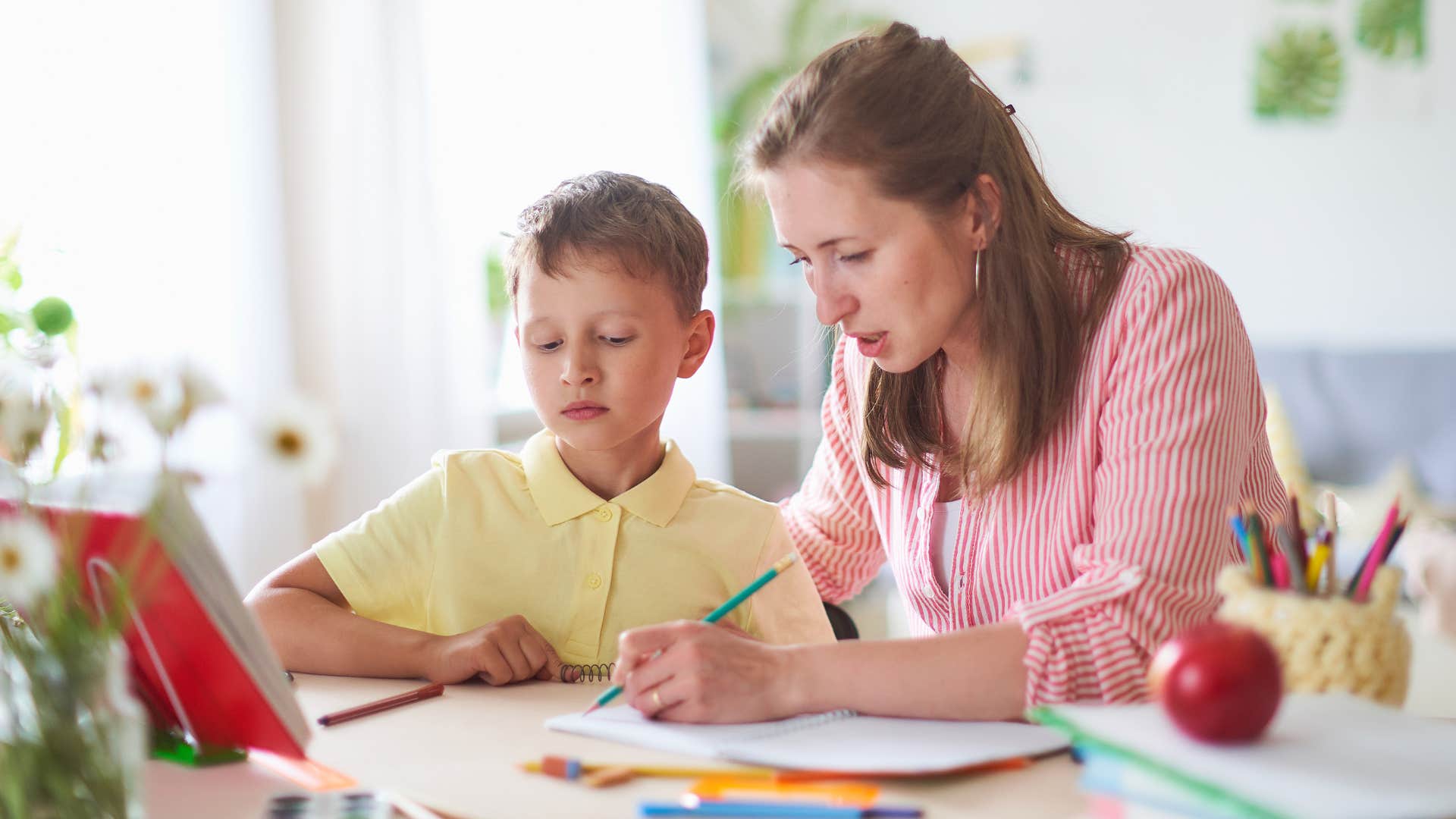 mom telling son to make his craft supplies last