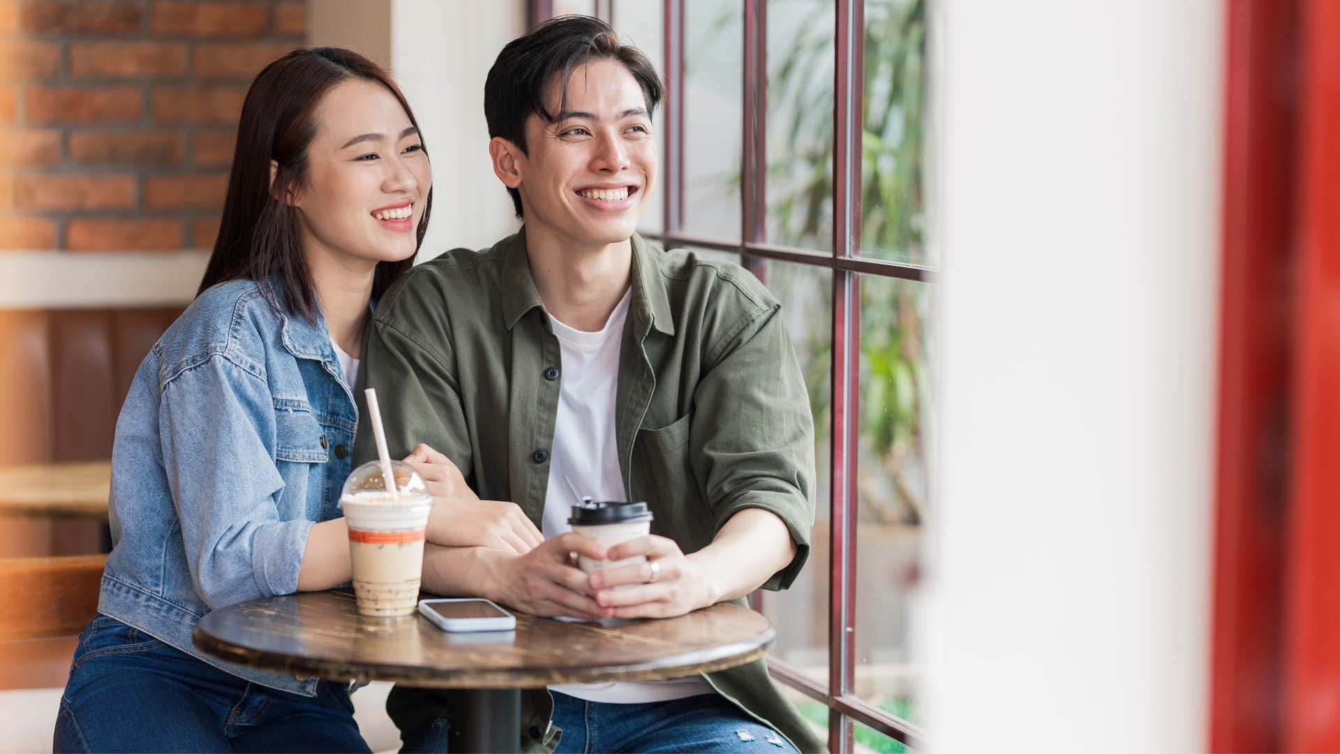 woman sitting with man thinking hes better than other guys