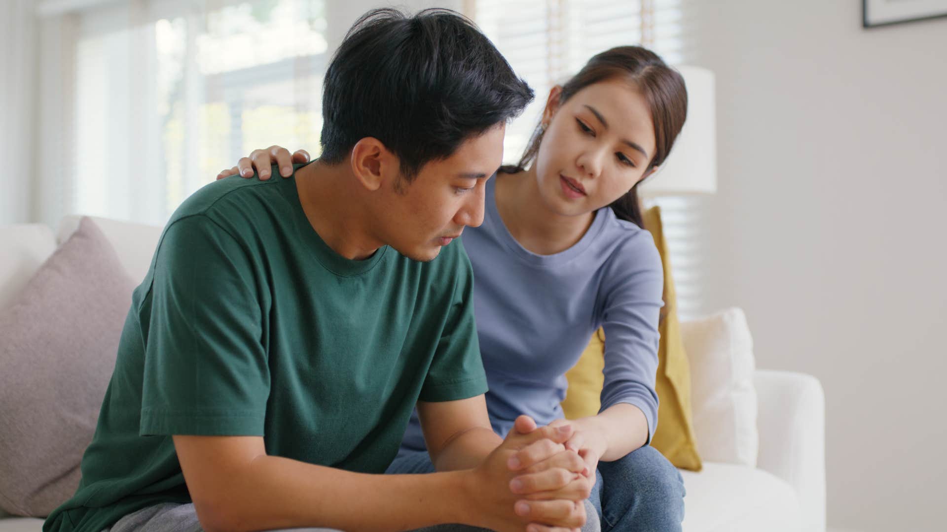 woman comforting man telling him no relationship is perfect