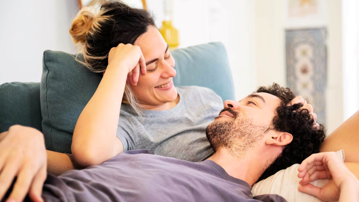 Couple embracing the best relationship advice from dozens of books.