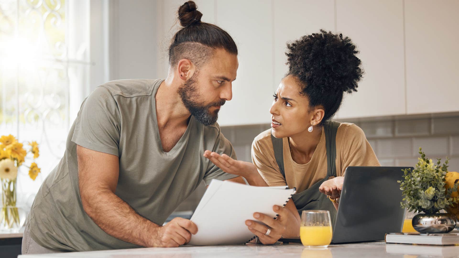 woman arguing with partner who's uncomfortable talking about money