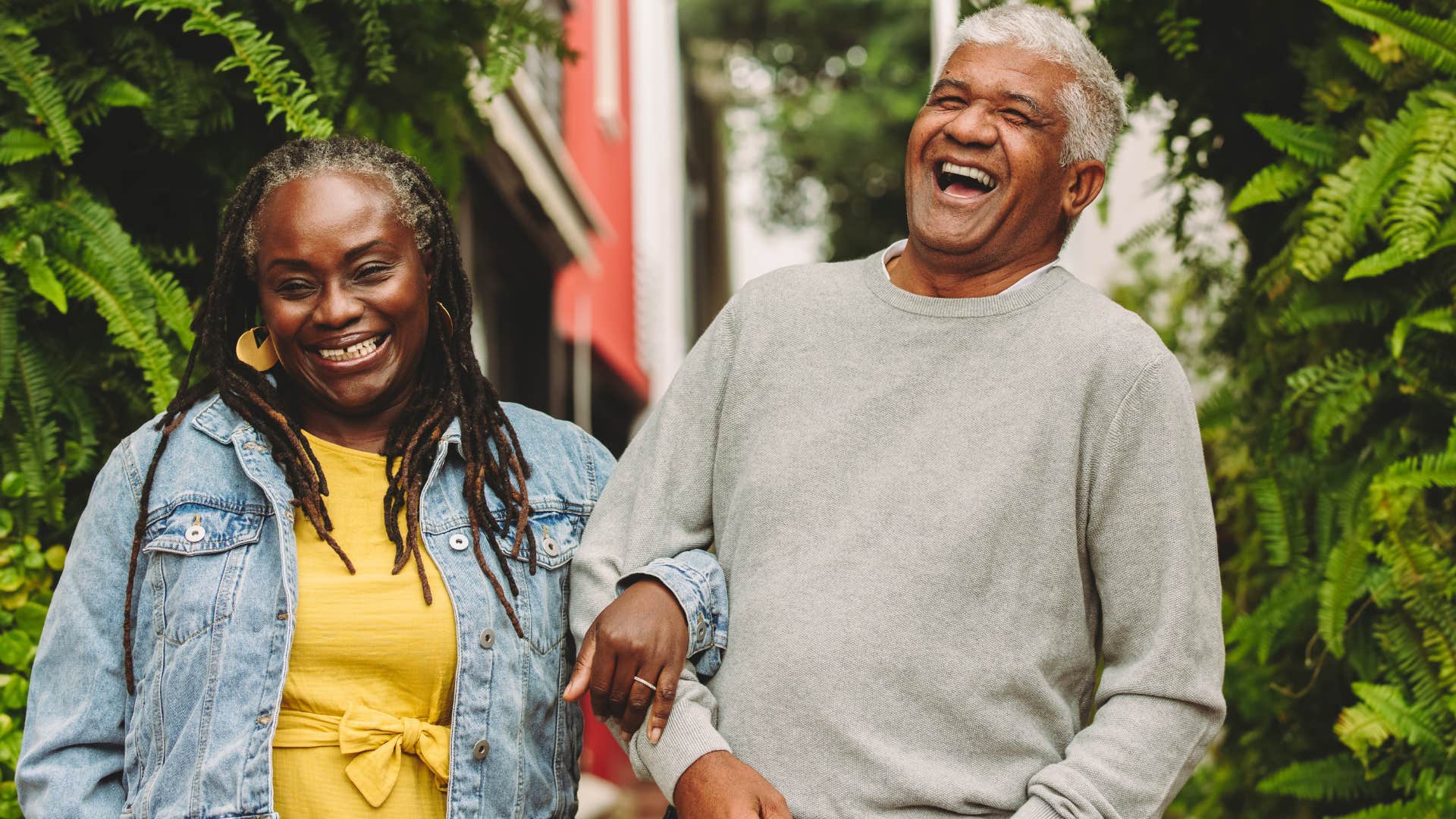 Man who plans his future with you smiling and walking with his wife.
