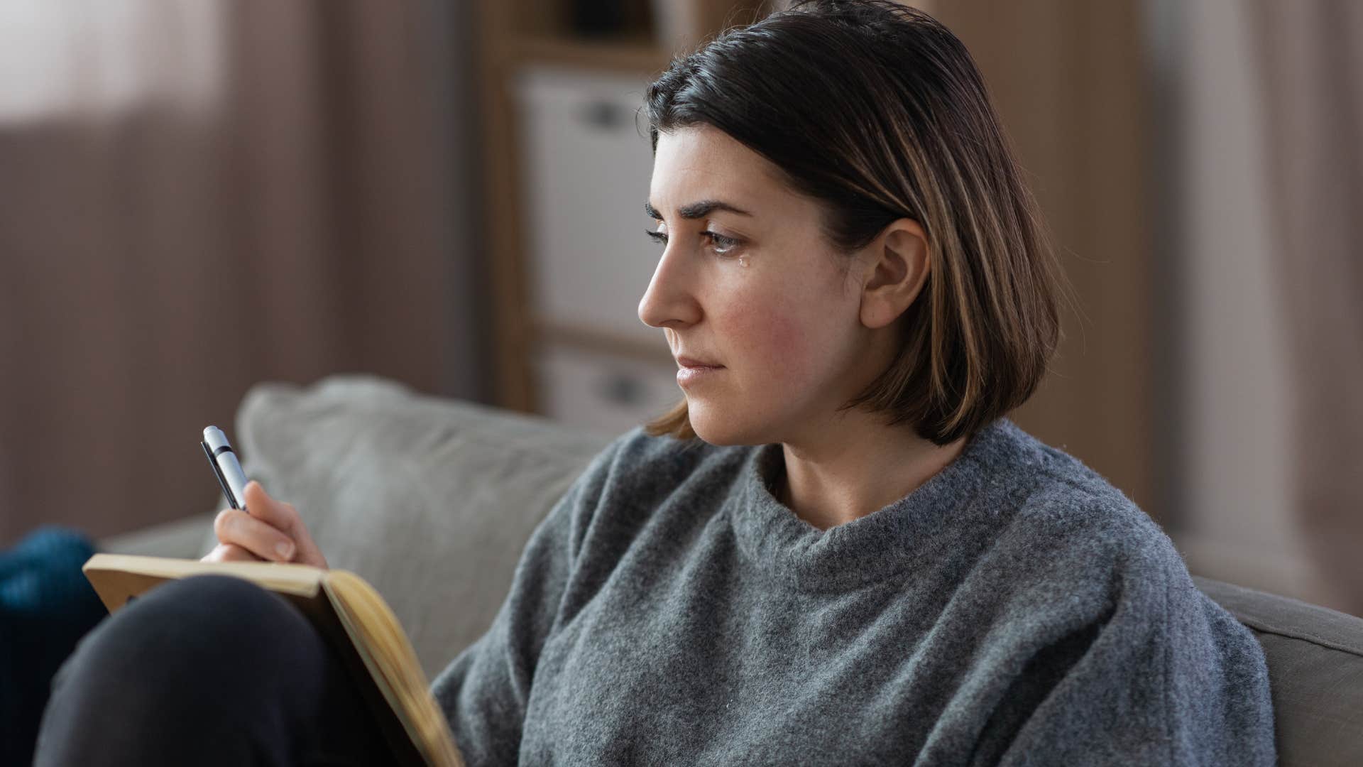 introverted woman journaling for self-reflection