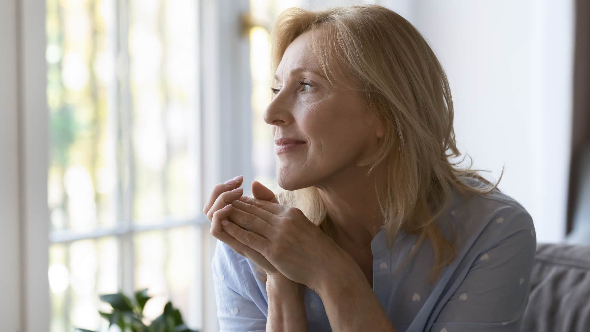 introverted woman recharging her social battery at home