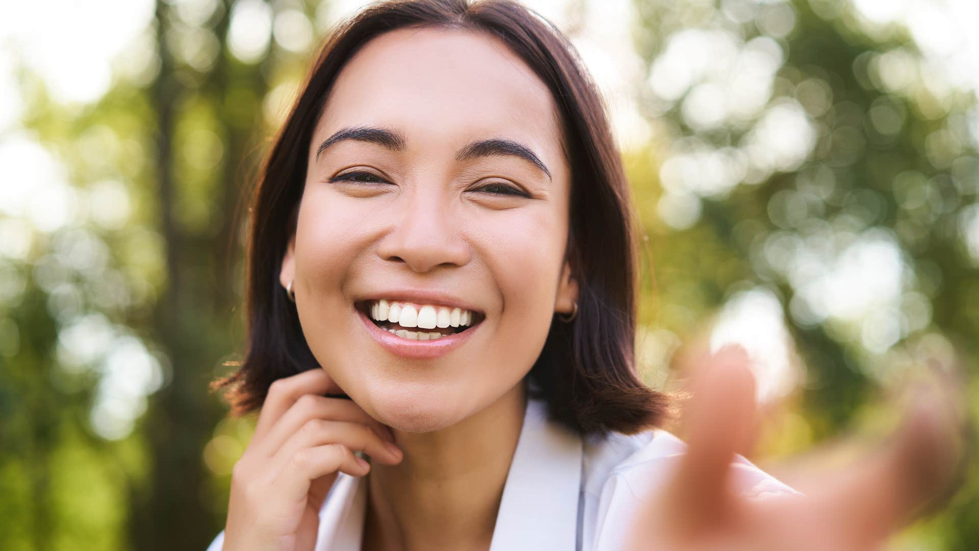smiling woman actively listening happily