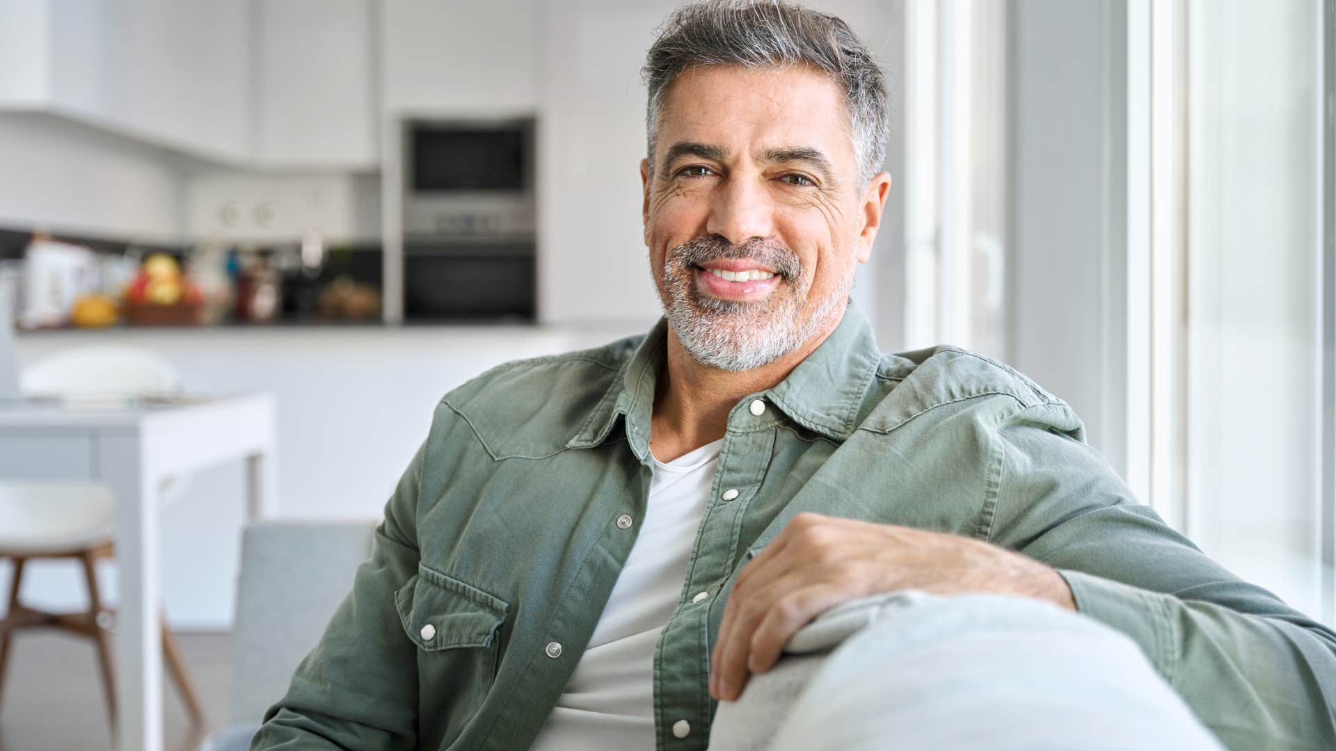 man avoiding gossip choosing to smile by himself