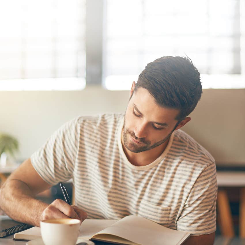 man with true confidence journaling