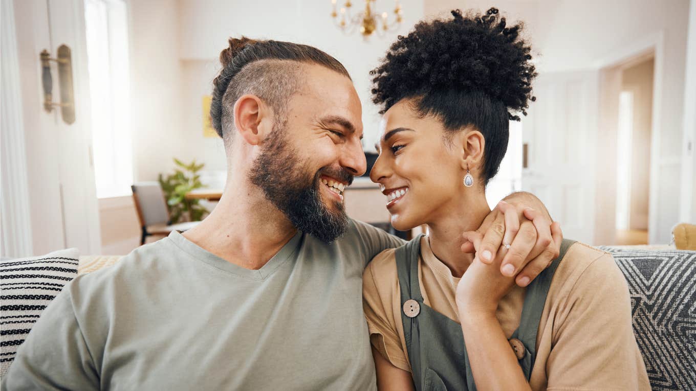 Rare Signs You're Being Treated Right In Your Relationship, According To Research happy couple in love smiling at each other