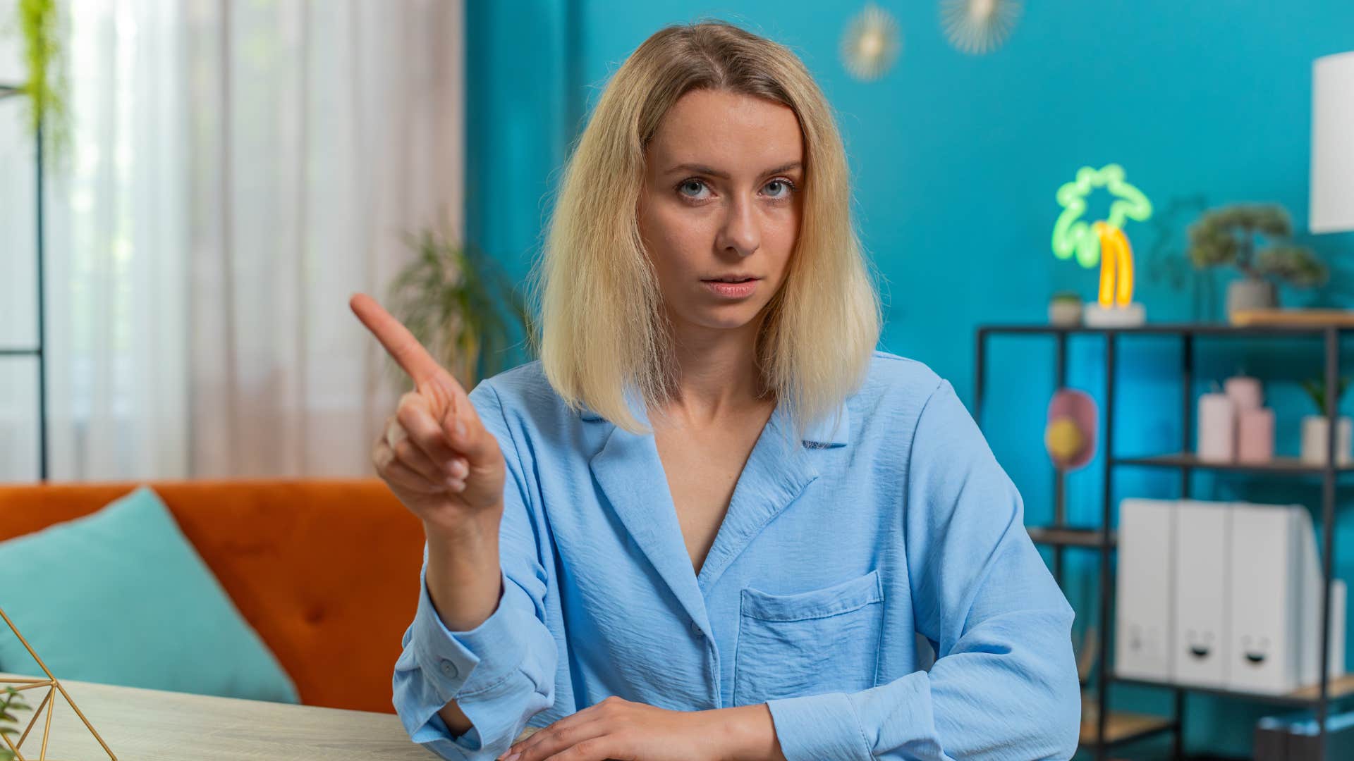 woman wagging finger to set boundaries 