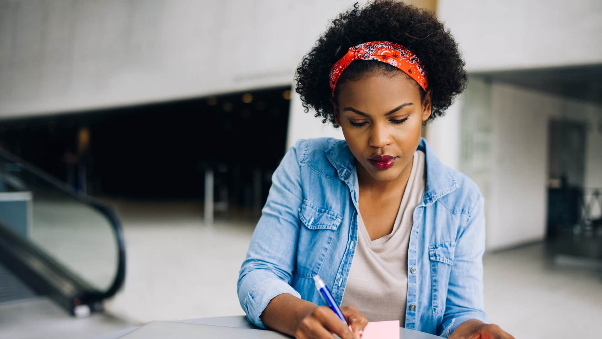 ambitious woman working hard writing