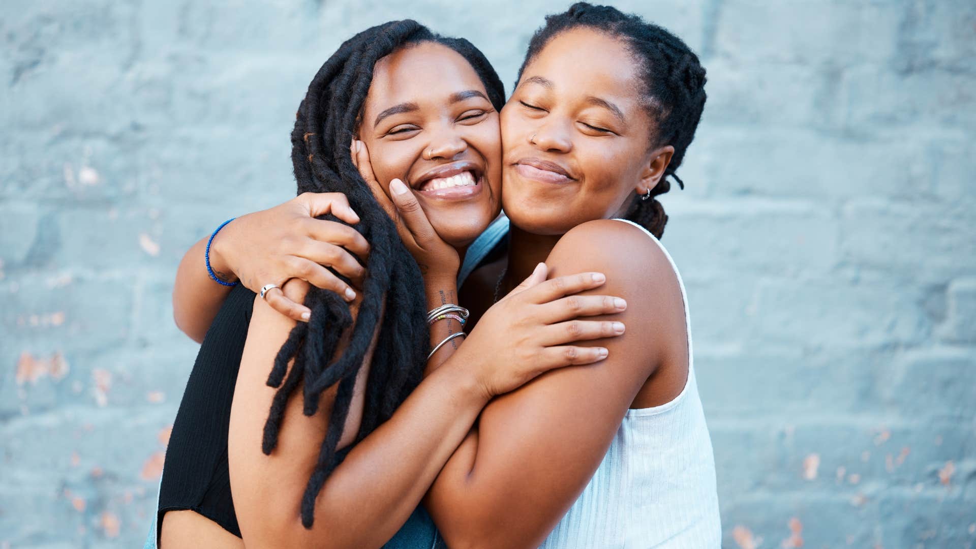 two friends hugging putting friendship first