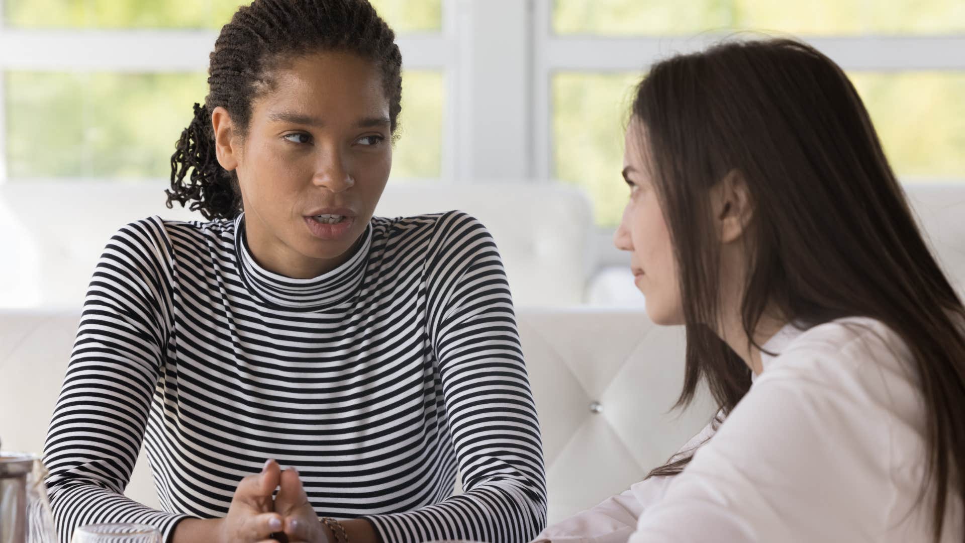 non-judgmental woman listening intently to friend