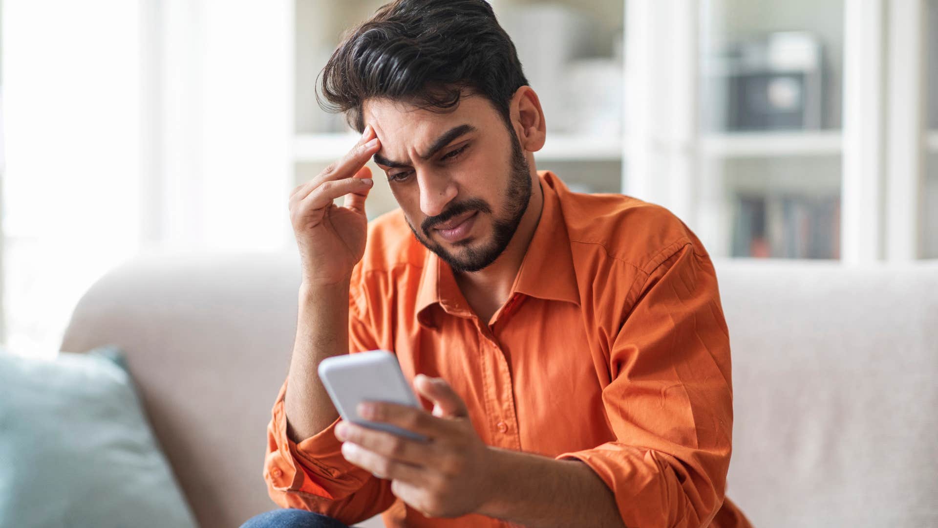 Upset man thinking about climate anxiety