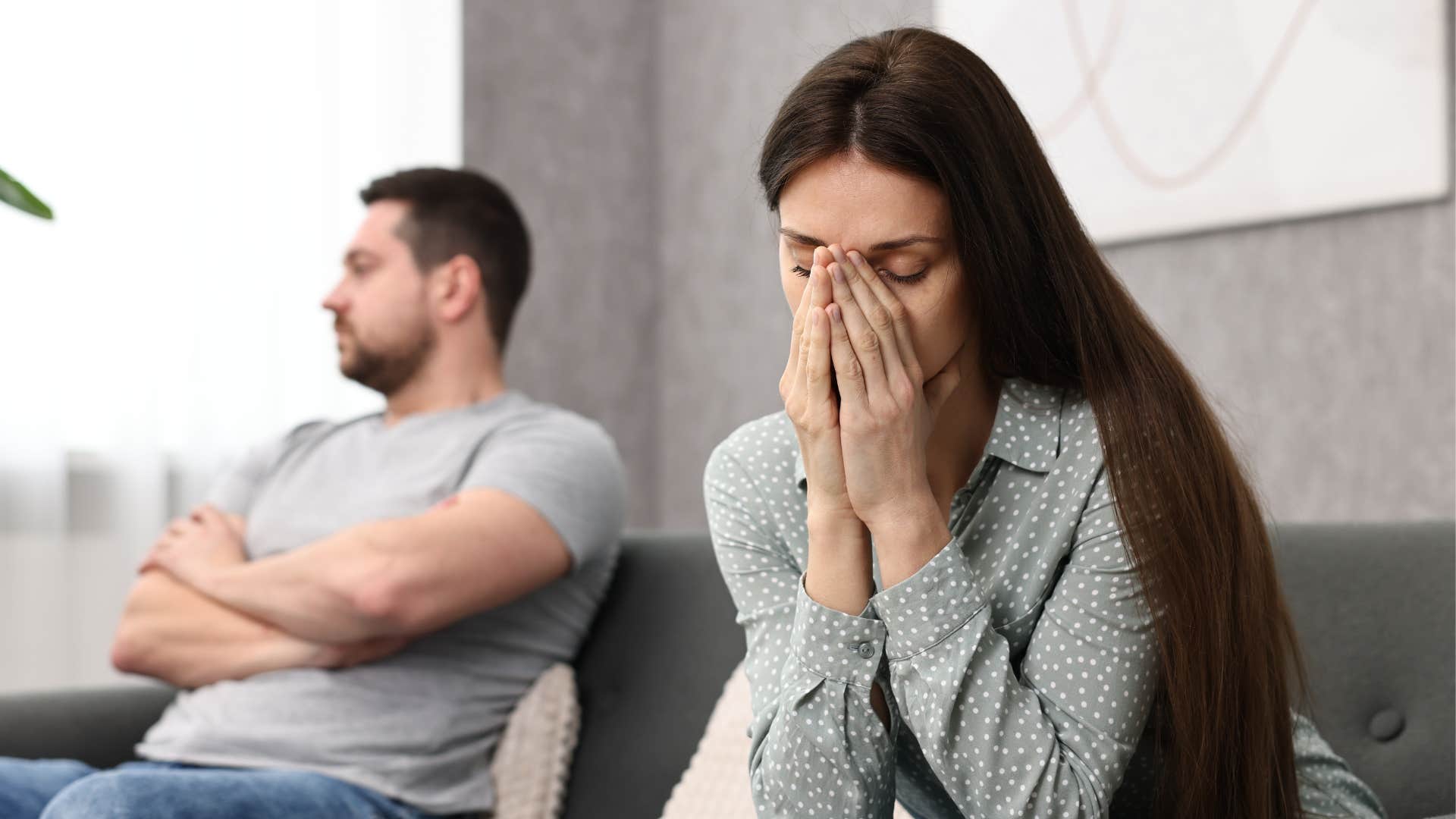 woman looking upset after husband blamed her for his lack of progress