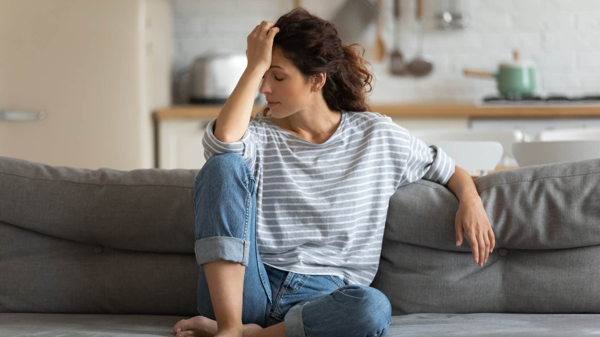 woman who is in a deep emotional mismatch feeling emotionally exhausted
