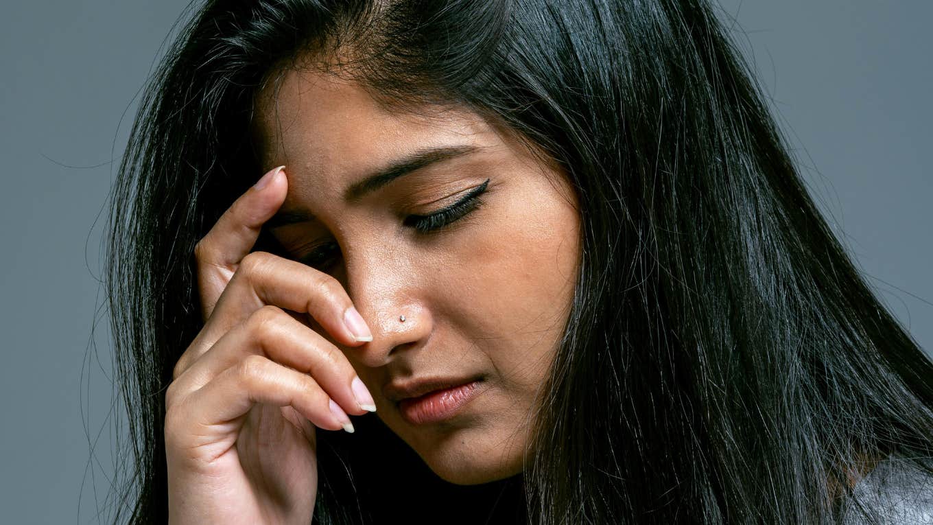 12 Subtle Relationship Issues That Are Actually Huge Warnings, According To Experts Woman realizes relationship warnings are huge.