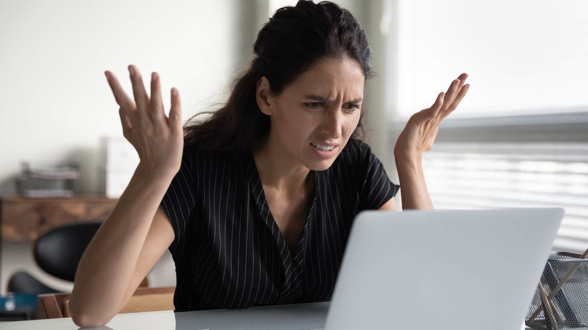 Woman angry at marketing jobs being automated at work.