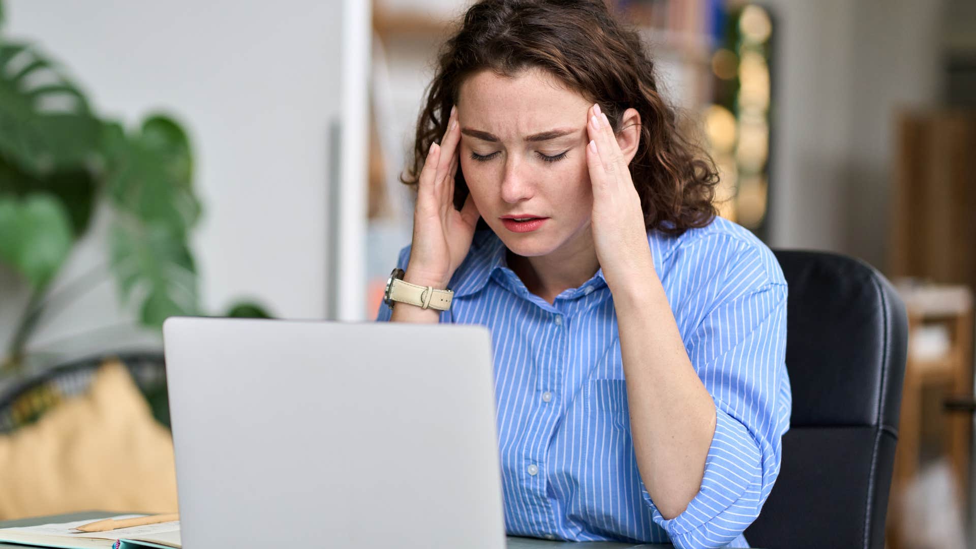 Annoyed woman thinking about surveillance software replacing management.