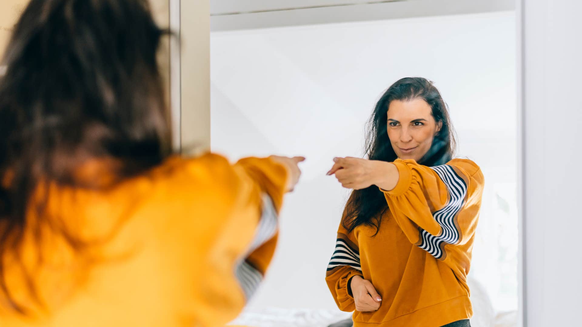 happy woman in the mirror who doesnt care what people think