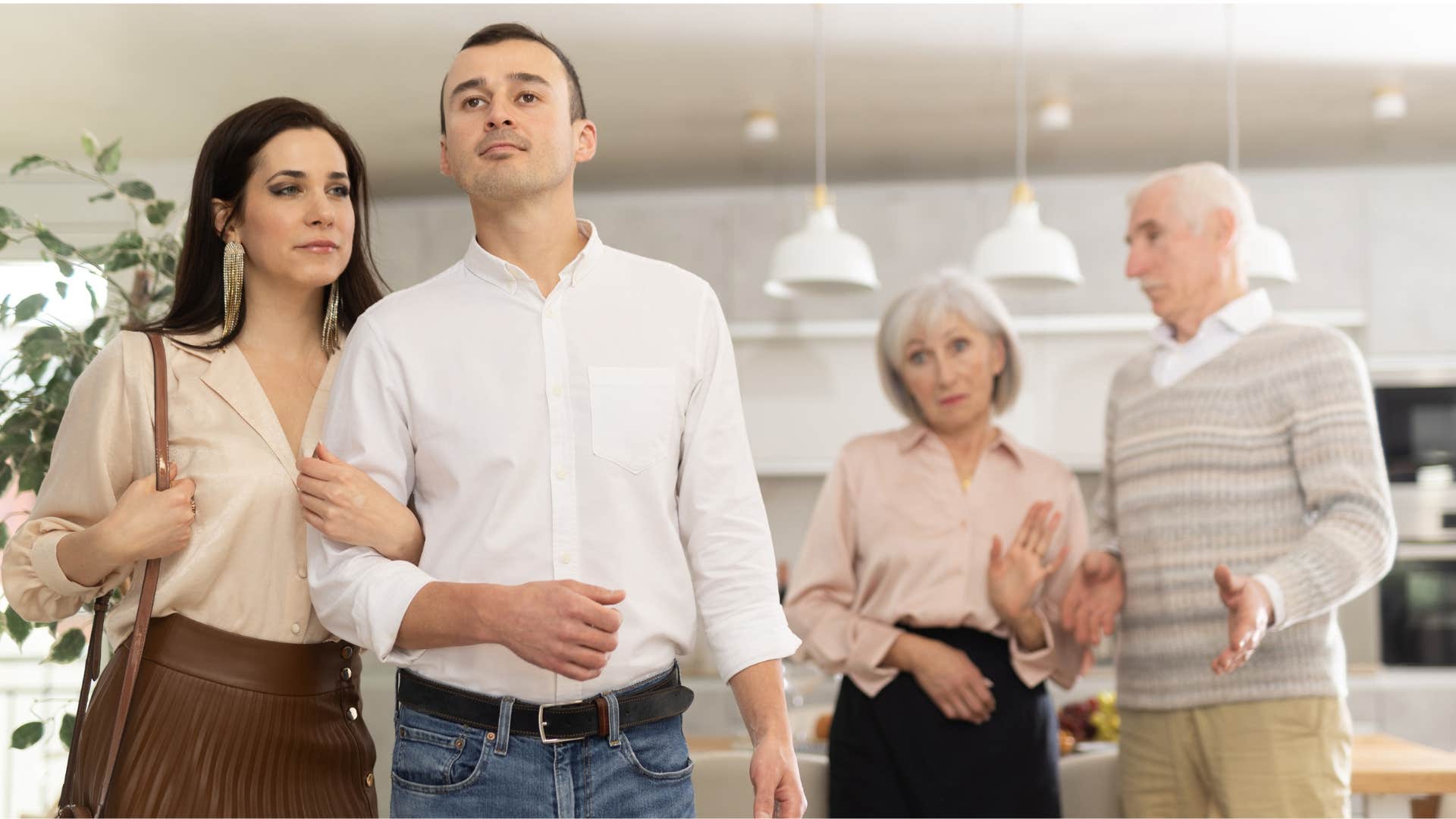 couple visiting man's parents who are divorced